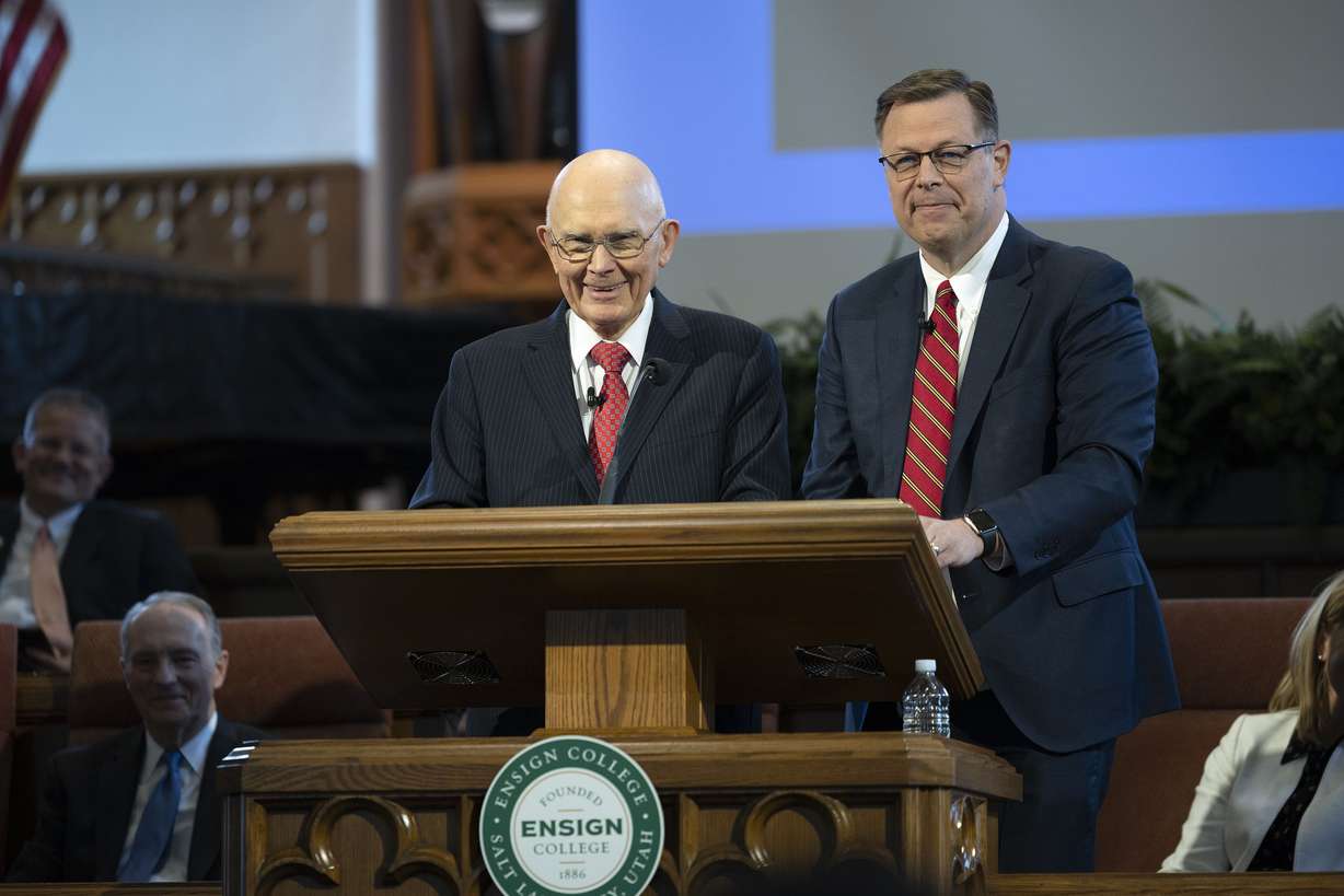 President Dallin H. Oaks, first counselor in the First Presidency of The Church of Jesus Christ of Latter-day Saints, left, and Elder Clark G. Gilbert, a general authority seventy and church commissioner of education, speak at an Ensign College devotional in the Assembly Hall on Temple Square in Salt Lake City on May 17.