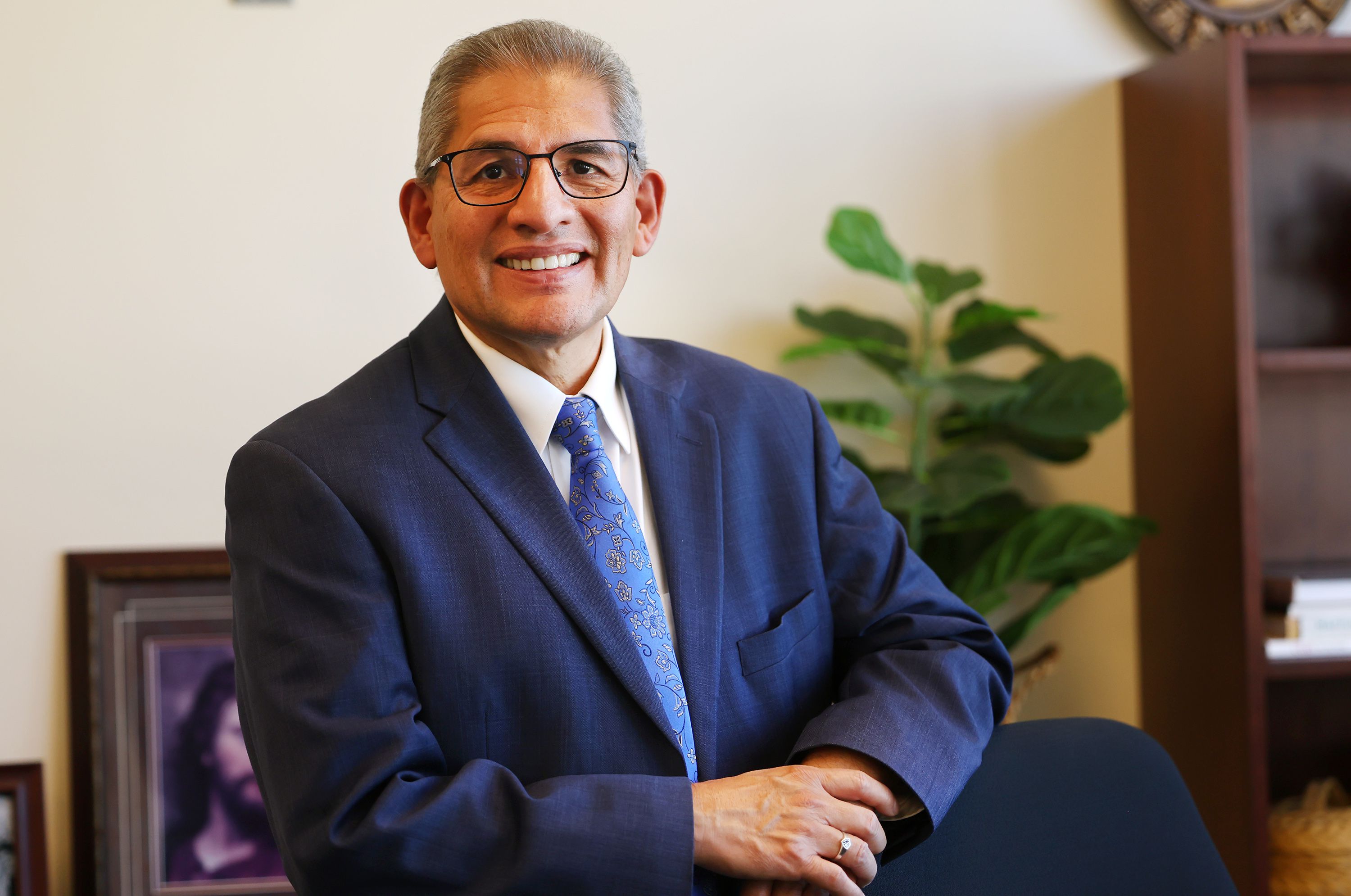 Carl Hernandez poses for a photo inside his office at the Smoot Administration Building on campus at Brigham Young University on Sept. 19.