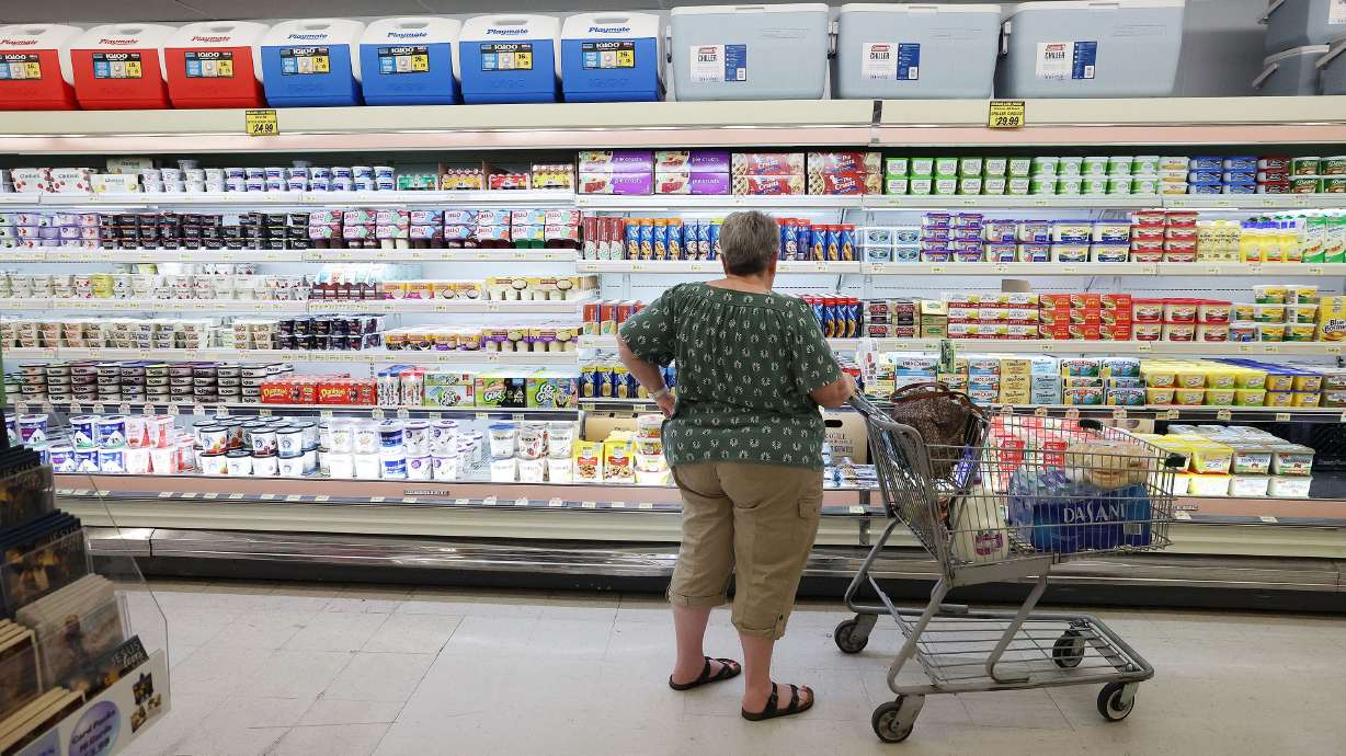 A shopper looks for food at Reams Food Store in Sandy on Friday, Sept. 23.