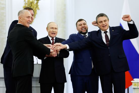 From left, Moscow-appointed head of Kherson Region Vladimir Saldo, Moscow-appointed head of Zaporizhzhia region Yevgeny Balitsky, Russian President Vladimir Putin, Denis Pushilin, leader of self-proclaimed of the Donetsk People's Republic and Leonid Pasechnik, leader of self-proclaimed Luhansk People's Republic pose for a photo during a ceremony to sign the treaties for four regions of Ukraine to join Russia, at the Kremlin in Moscow, Friday. The signing of the treaties making the four regions part of Russia follows the completion of the Kremlin-orchestrated "referendums."