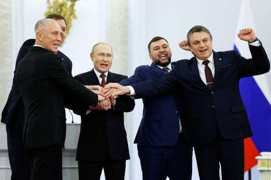 From left, Moscow-appointed head of Kherson Region Vladimir Saldo, Moscow-appointed head of Zaporizhzhia region Yevgeny Balitsky, Russian President Vladimir Putin, Denis Pushilin, leader of self-proclaimed of the Donetsk People's Republic and Leonid Pasechnik, leader of self-proclaimed Luhansk People's Republic pose for a photo during a ceremony to sign the treaties for four regions of Ukraine to join Russia, at the Kremlin in Moscow, Friday. The signing of the treaties making the four regions part of Russia follows the completion of the Kremlin-orchestrated "referendums."