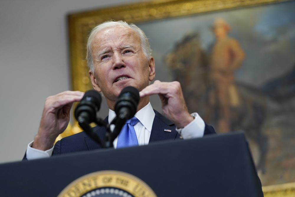 President Joe Biden speaks about the ongoing federal response efforts for Hurricane Ian from the Roosevelt Room at the White House in Washington, Friday. Biden warned Moscow that it won't "get away" with seizing Ukrainian land. 