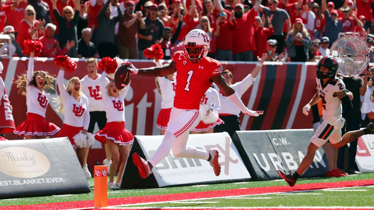 Utah Utes cornerback Clark Phillips III (1) glides into the end zone for a touchdown after intercepting a pass as Utah and Oregon State play at Rice Eccles Stadium in Salt Lake City on Saturday, Oct. 1, 2022.
