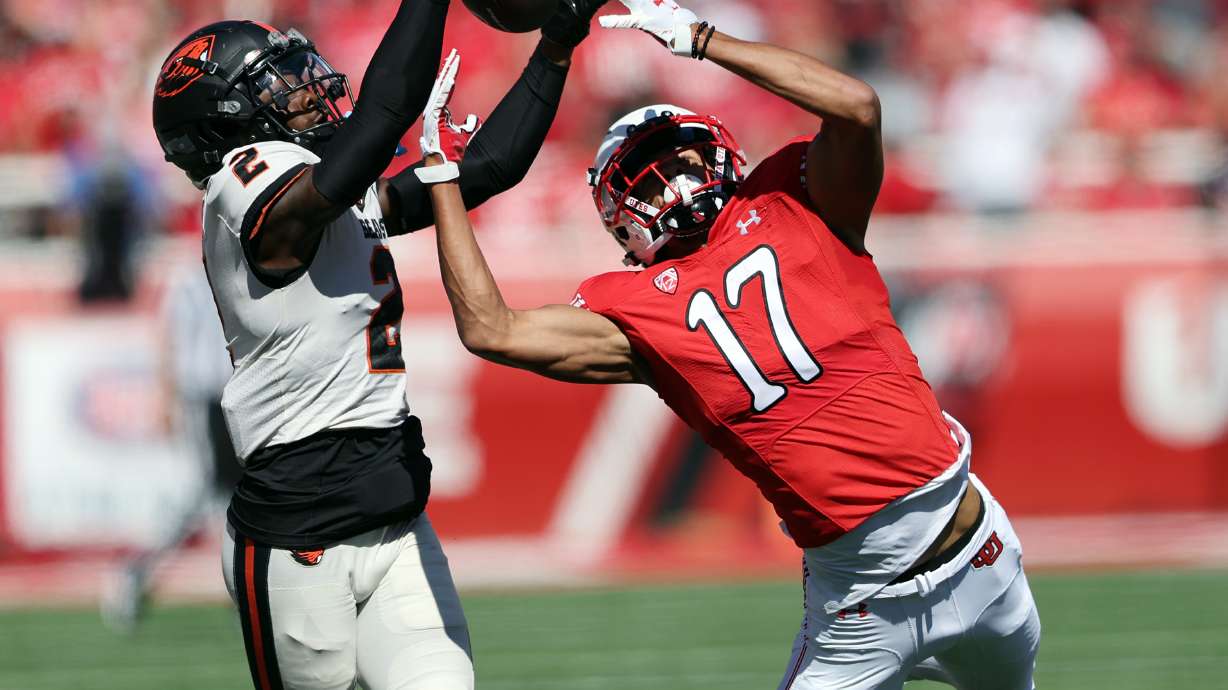 Oregon State Beavers defensive back Rejzohn Wright (2) and Utah Utes wide receiver Devaughn Vele (17) battle for the ball down the sideline as Utah and Oregon State play at Rice Eccles Stadium in Salt Lake City on Saturday, Oct. 1, 2022. The pass was incomplete.