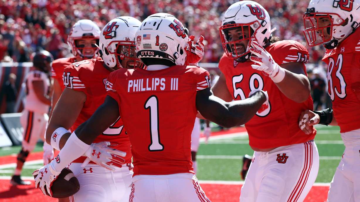 Utah Utes cornerback Clark Phillips III (1) celebrates a touchdown with teammates as Utah and Oregon State play at Rice Eccles Stadium in Salt Lake City on Saturday, Oct. 1, 2022.