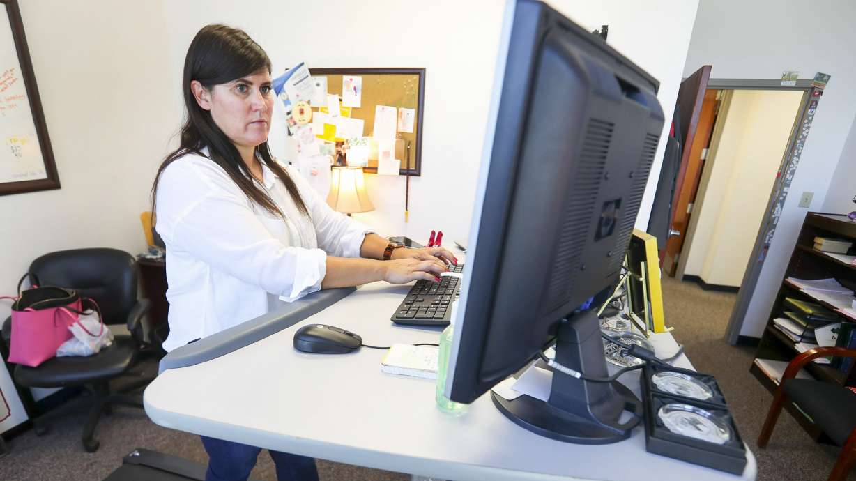 West Valley City prosecutor Yvette Rodier works on her treadmill desk in the West Valley City Justice Court building on Sept. 4, 2019.