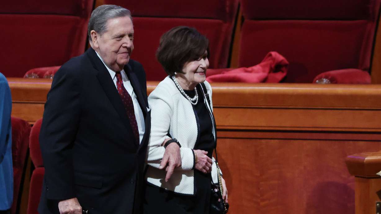 Elder Jeffrey R. Holland and his wife Sister Patricia Holland leave the Sunday morning session of general conference on Oct. 2, 2022. The Church of Jesus Christ of Latter-day Saints announced on Thursday that Elder Jeffrey R. Holland has been hospitalized for treatment and observation of ongoing medical issues.