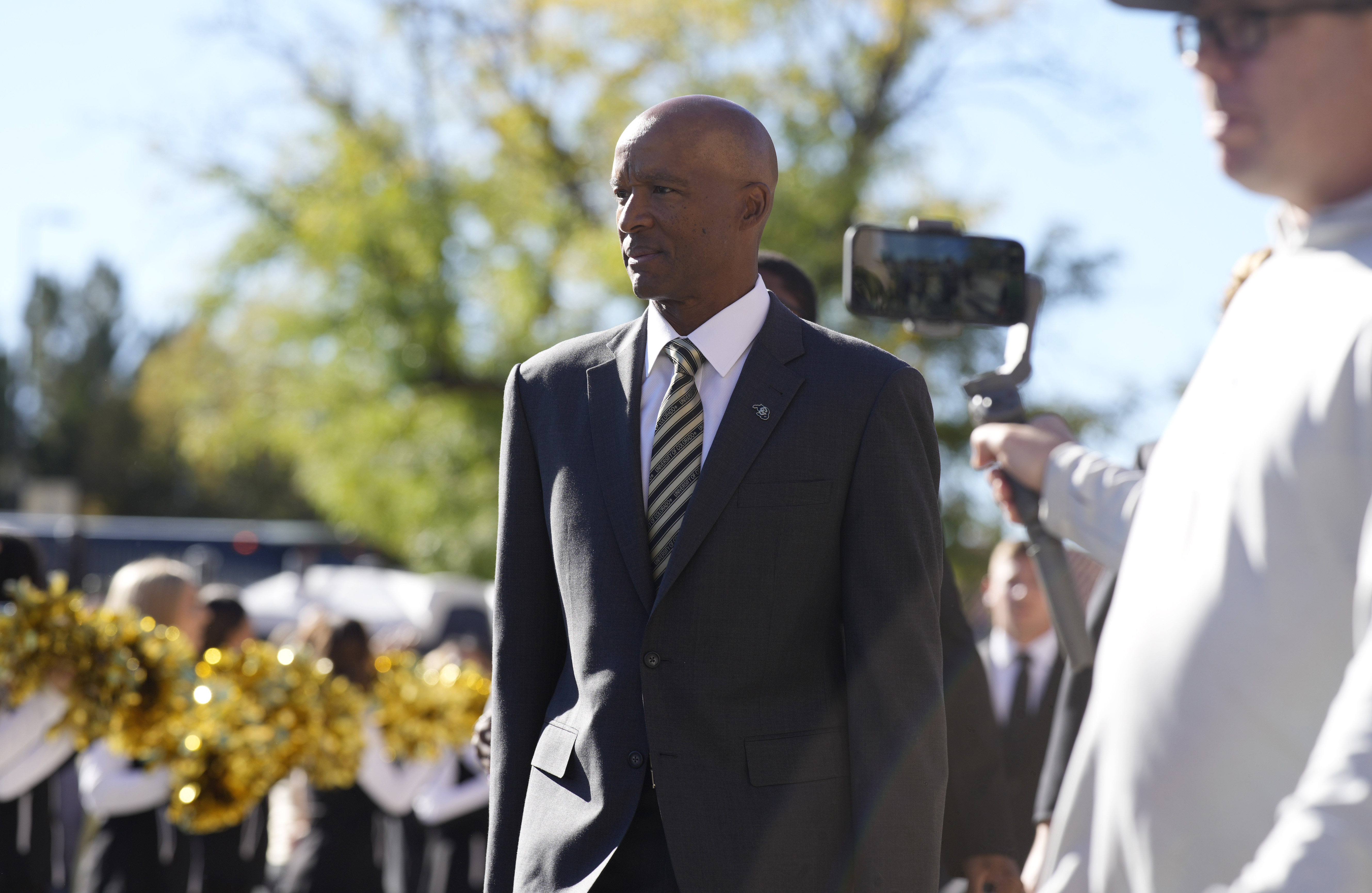 Colorado head coach Karl Dorrell arrives with his players at Folsom Field before an NCAA college football game against UCLA Saturday, Sept. 24, 2022, in Boulder, Colo. 
