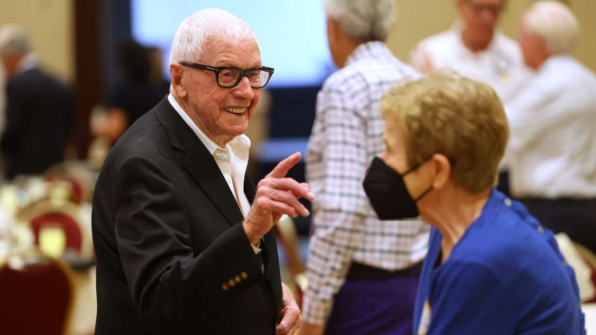 Duane C. Hill, left, talks with Rolayne Fairclough as the Salt Lake Rotary Club meets at the Salt Lake Marriott Downtown at City Creek on Sept. 6.