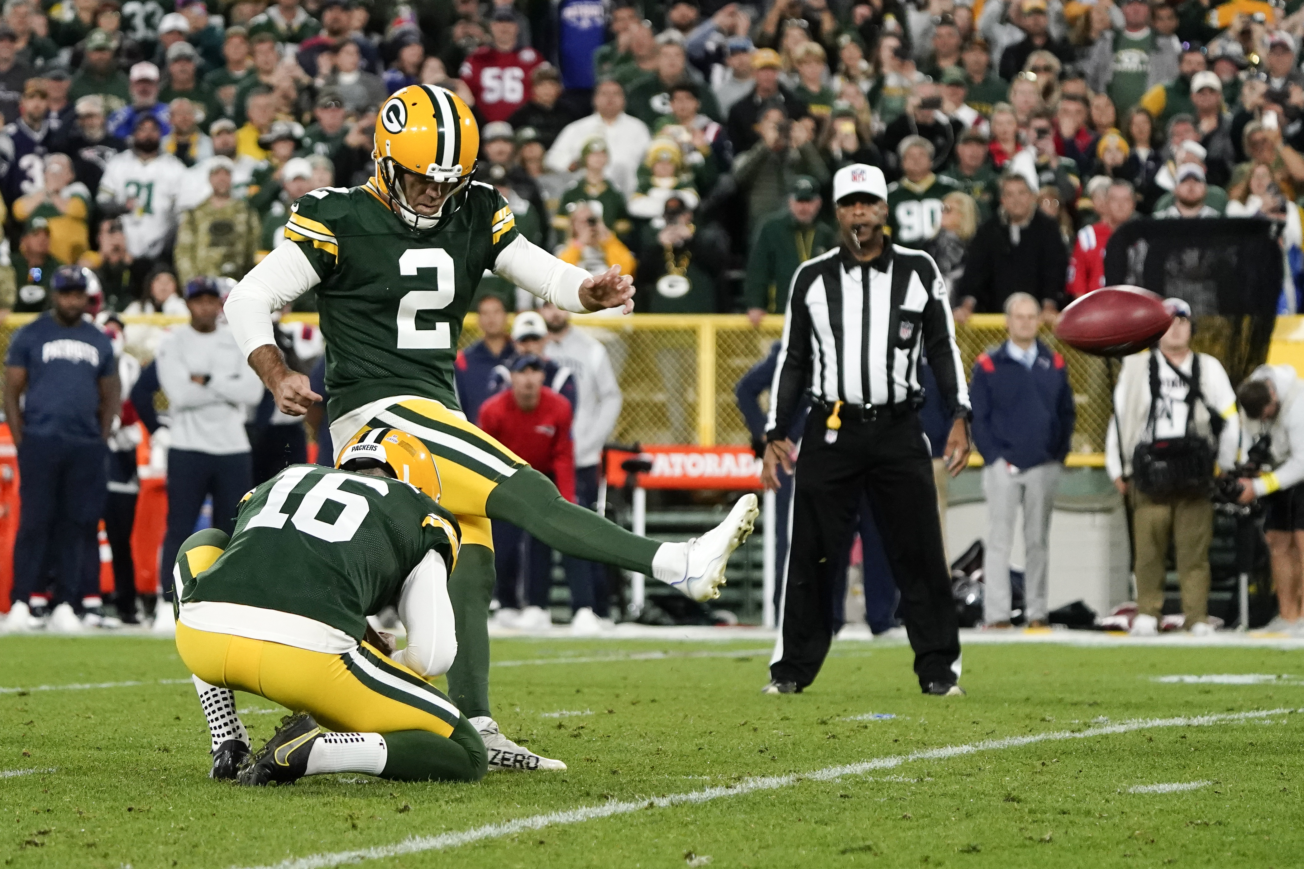 Green Bay Packers place kicker Mason Crosby (2) kicks a 31-yard field goal during overtime in an NFL football game against the New England Patriots, Sunday, Oct. 2, 2022, in Green Bay, Wis. The Packers won 27-24. 