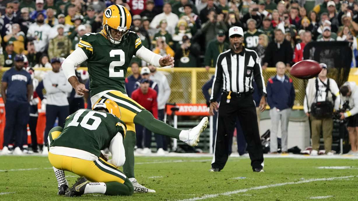 Green Bay Packers place kicker Mason Crosby (2) kicks a 31-yard field goal during overtime in an NFL football game against the New England Patriots, Sunday, Oct. 2, 2022, in Green Bay, Wis. The Packers won 27-24.