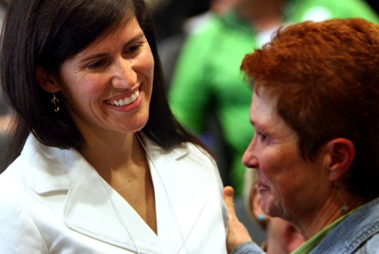 Yvette Rodier, left, is greeted by a conference attendee after Rodier spoke at the Utah Council on Victims of Crime 22nd Annual Crime Victims' Conference at the state Capitol in Salt Lake City on April 29, 2009.