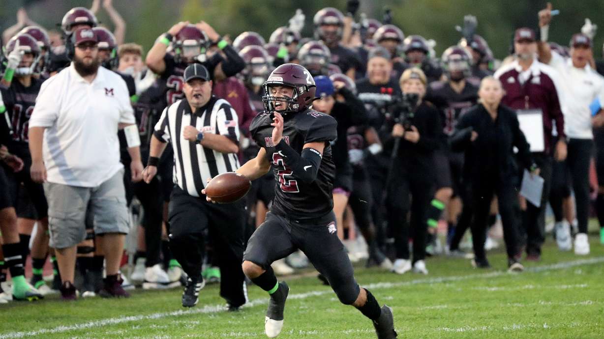 Morgan fans cheer as Morgan plays Grantsville in a varsity football game at Morgan High School in Morgan on Friday, Sept. 30, 2022.