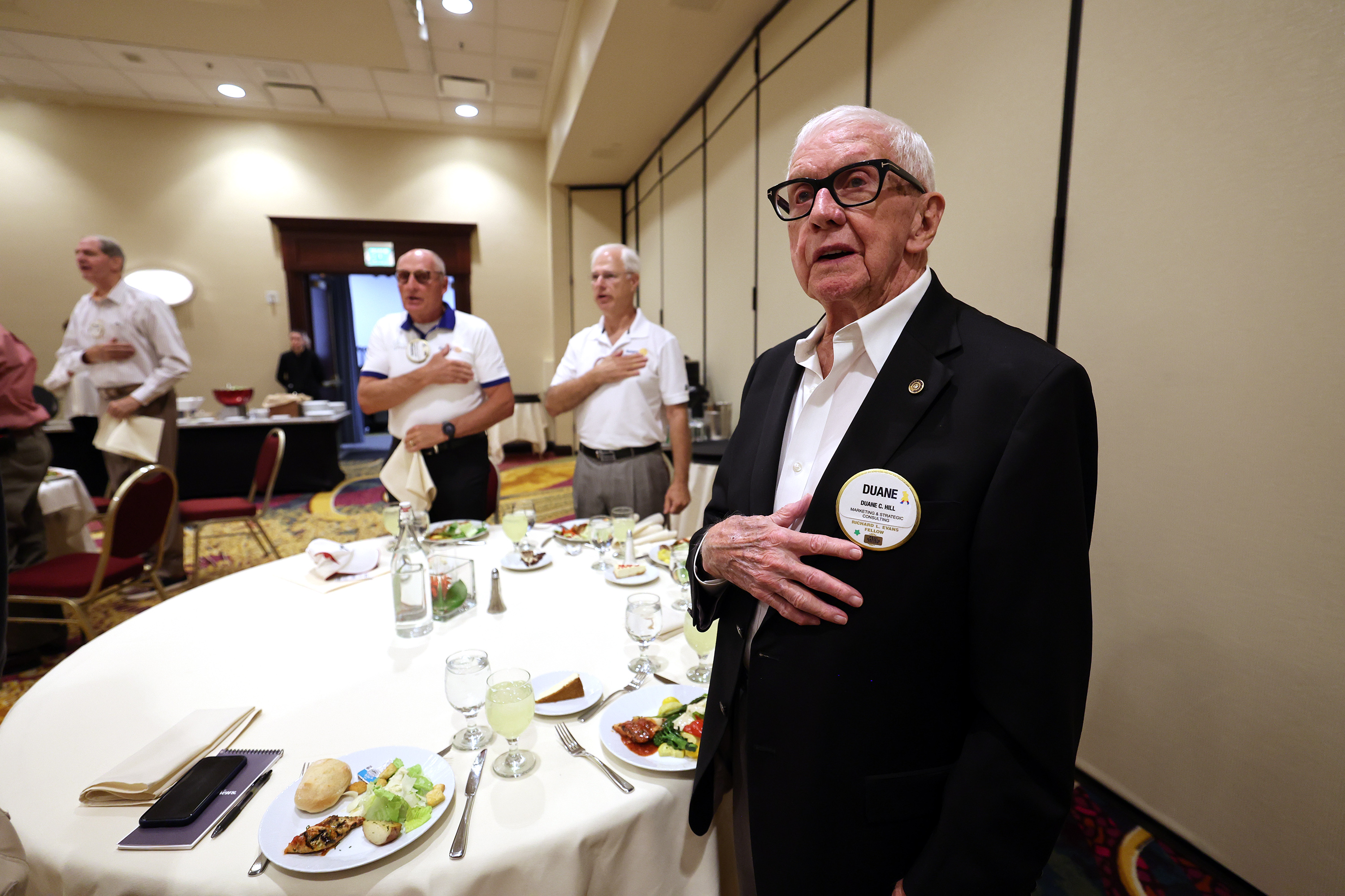 Duane C. Hill joins with the others in saying the Pledge of Allegiance as the Salt Lake Rotary Club meets at the Salt Lake Marriott Downtown at City Creek on Tuesday, Sept. 6, 2022.