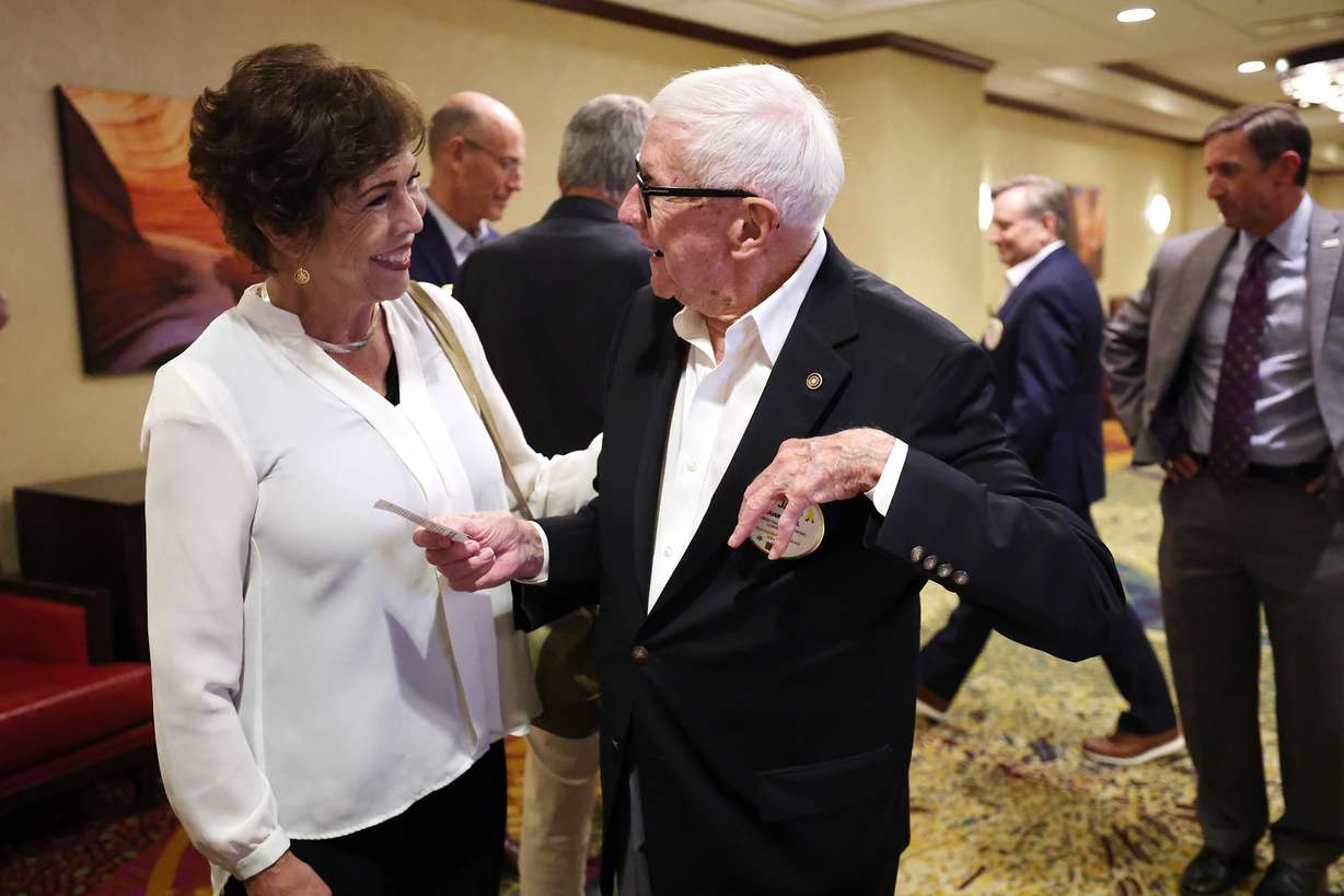 Paula Fellingham, left, and Duane C. Hill talk prior to attending the Salt Lake Rotary Club meeting at the Salt Lake Marriott Downtown at City Creek on Tuesday, Sept. 6, 2022.