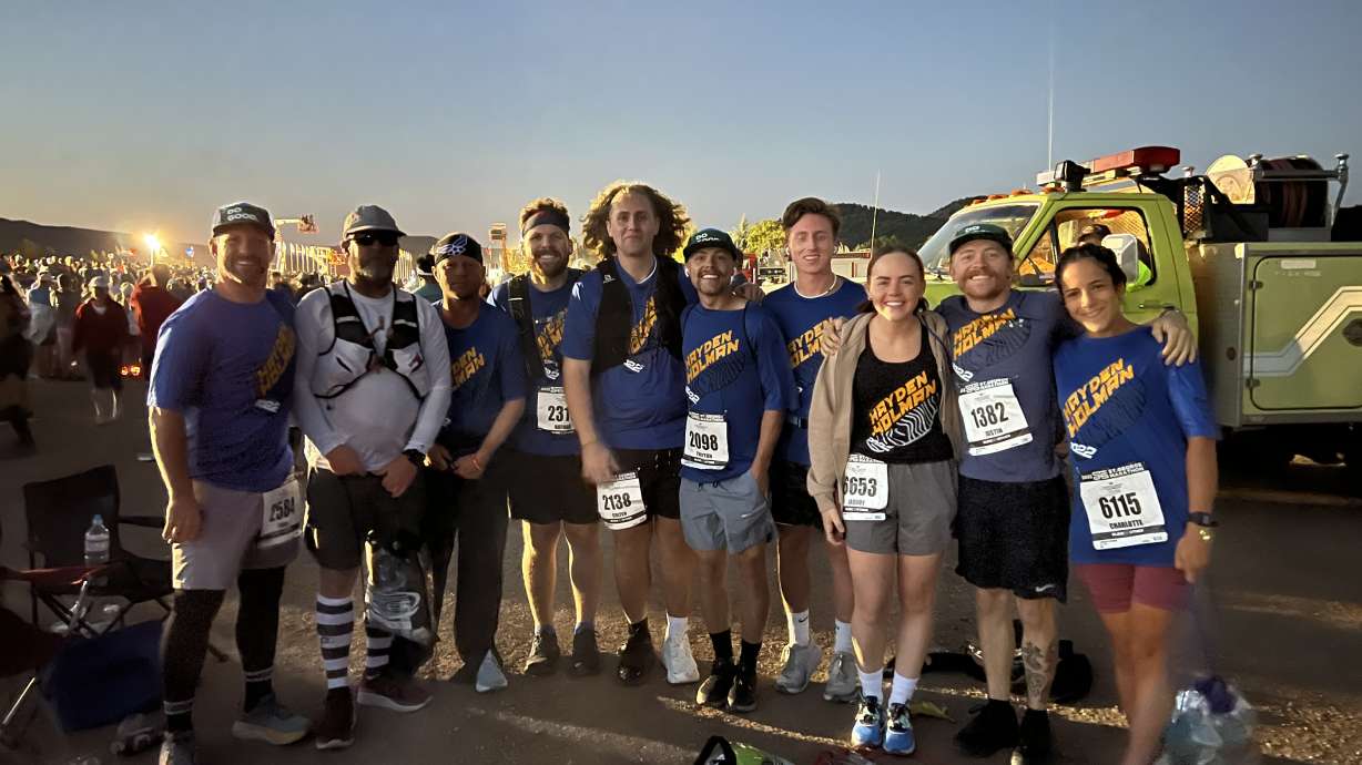 Todd Holman, Blake Holman, Greg Holman, Nathan Andrus, Colten Clements, Treyton Holman, Nathan Clements, Jaquoy Holman, Justin Holman and Charlotte Holman pose for a photo ahead of the St. George Marathon in St. George on Saturday. The group ran the race to honor 22-year-old Hayden Holman, who died in last year's marathon.