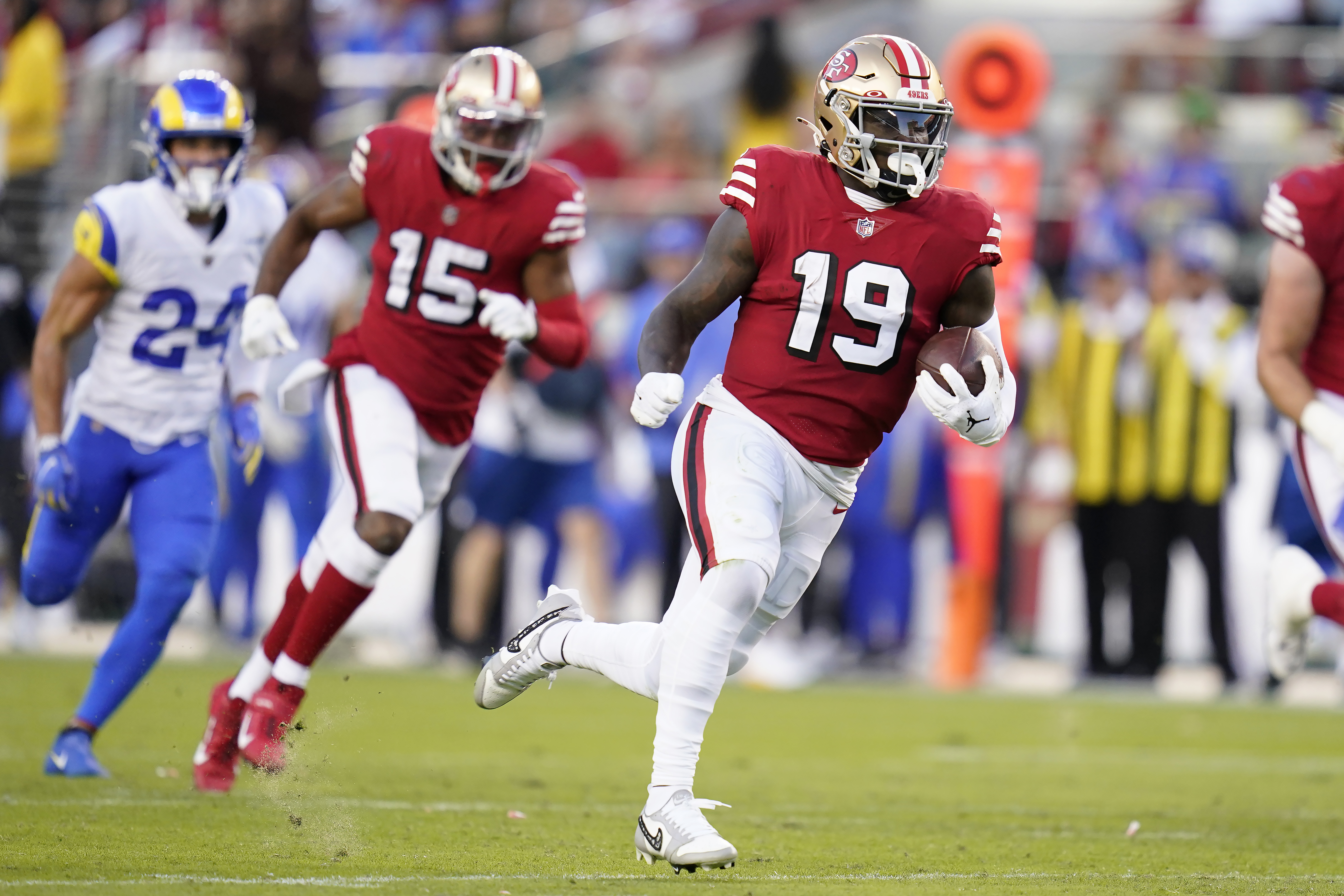 San Francisco 49ers wide receiver Deebo Samuel (19) runs toward the end zone to score against the Los Angeles Rams during the first half of an NFL football game in Santa Clara, Calif., Monday, Oct. 3, 2022. 