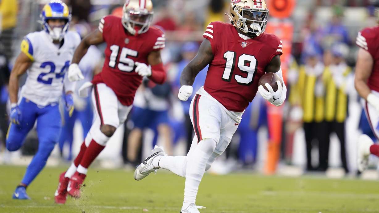 San Francisco 49ers wide receiver Deebo Samuel (19) runs toward the end zone to score against the Los Angeles Rams during the first half of an NFL football game in Santa Clara, Calif., Monday, Oct. 3, 2022.