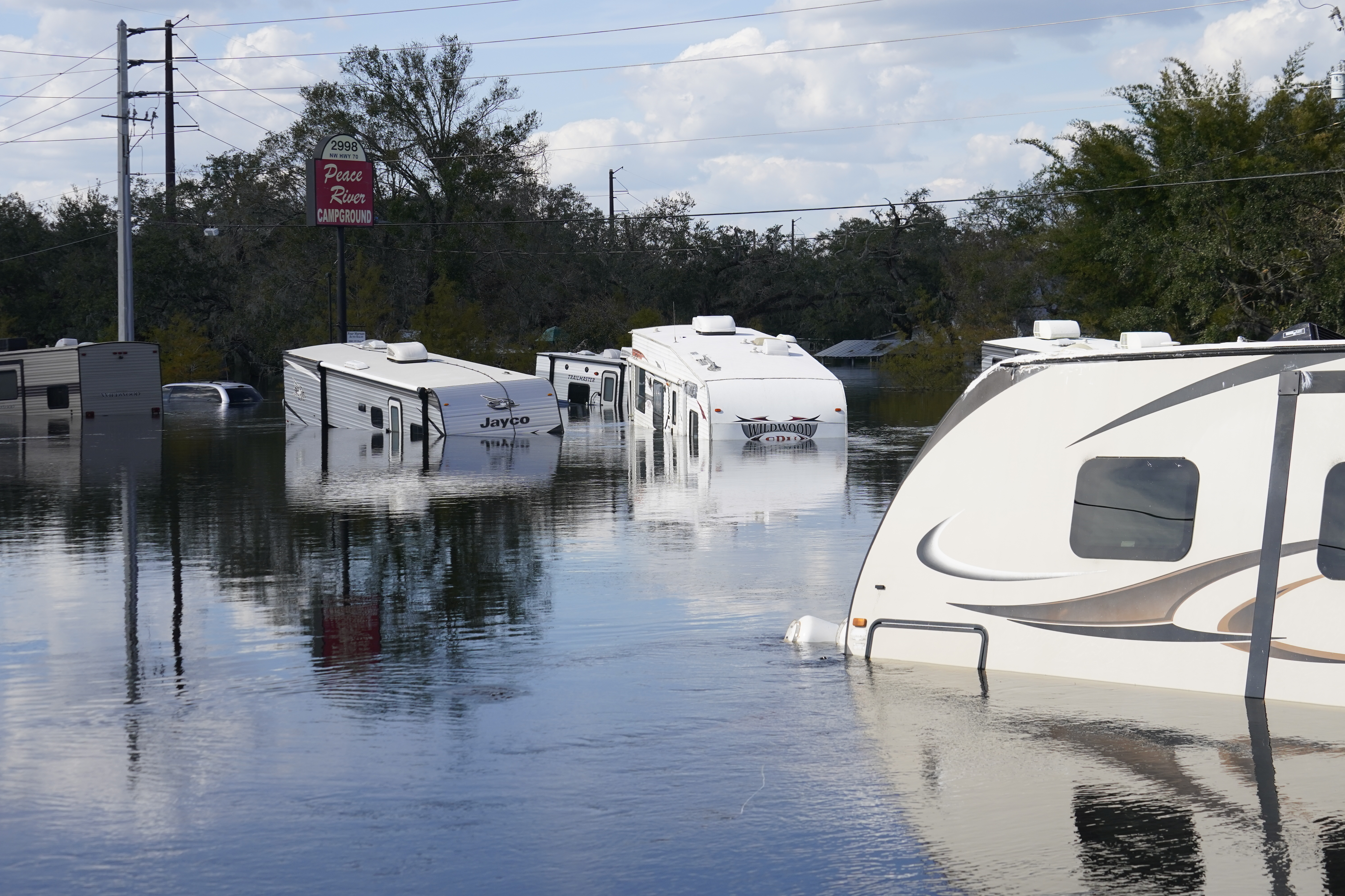 Flooded campers are seen at the Peace River Campground in the aftermath of Hurricane Ian in Arcadia, Fla., Monday.