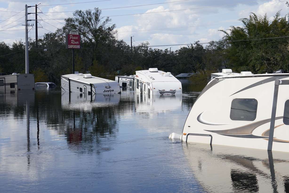 Flooded campers are seen at the Peace River Campground in the aftermath of Hurricane Ian in Arcadia, Fla., Monday.
