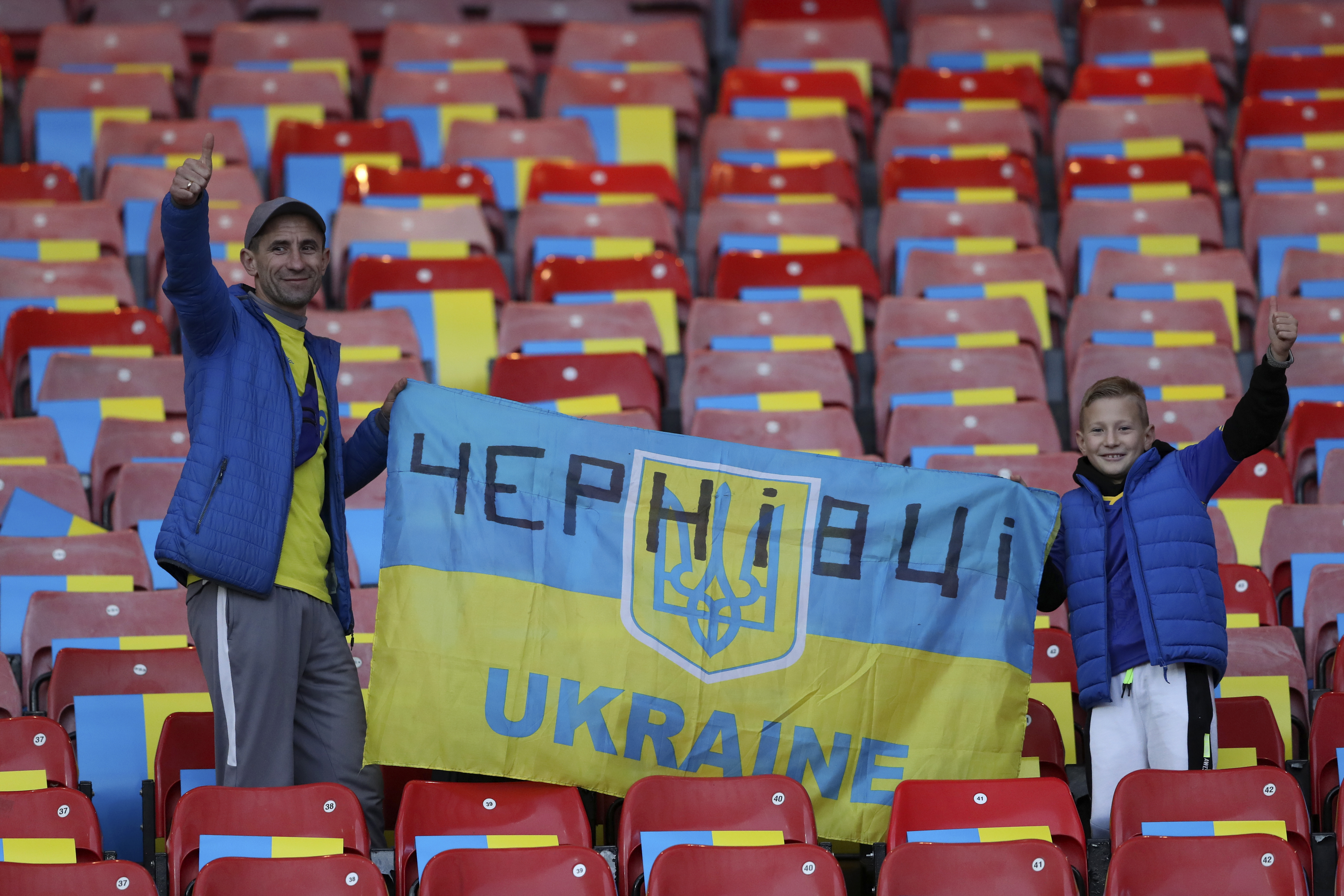 Ukrainian fans cheer prior to the star of the UEFA Nations League soccer match between Scotland and Ukraine, at Hampden Park, in Glasgow, Scotland, Wednesday, Sept. 21, 2022. 