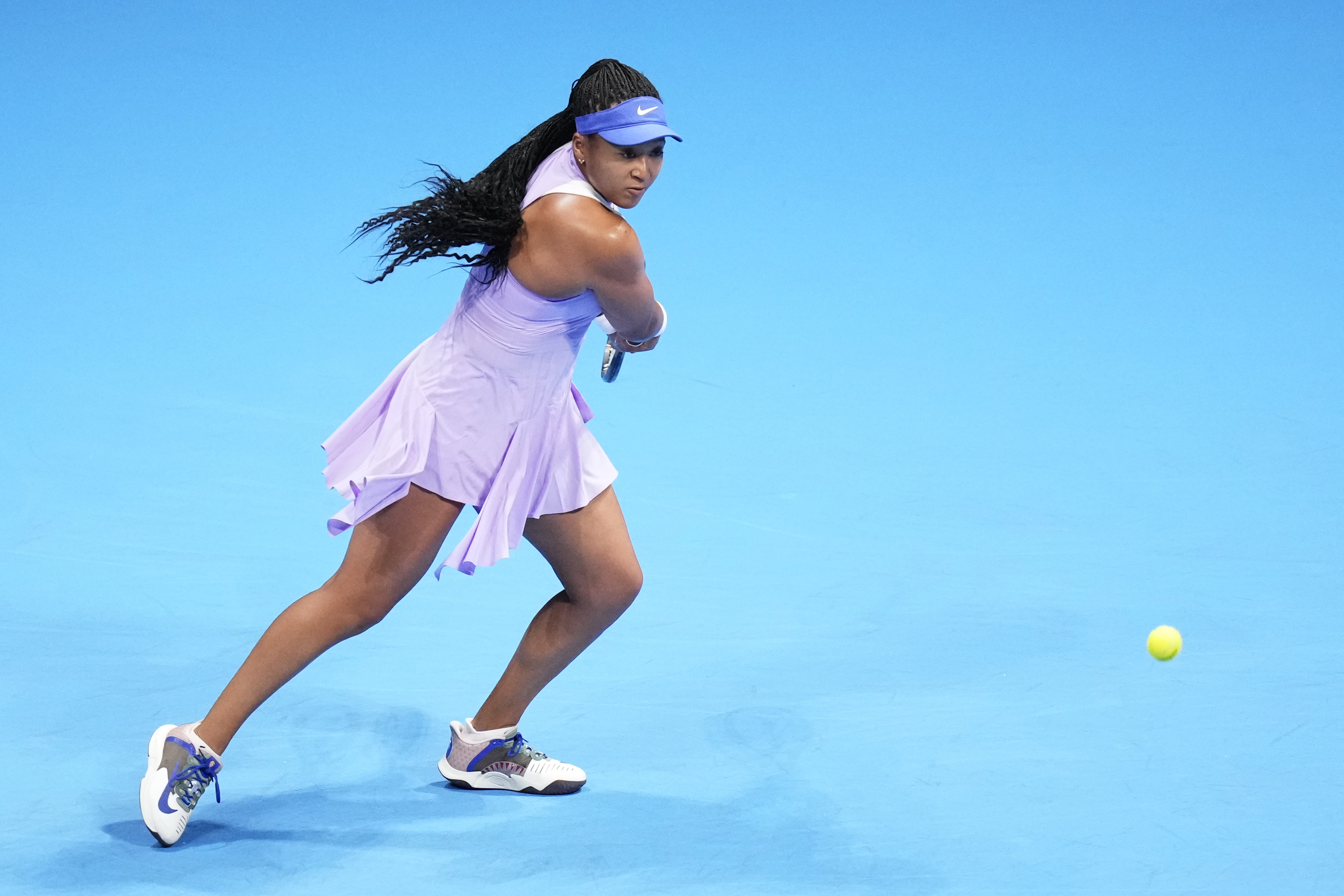 Naomi Osaka of Japan returns a shot against Daria Saville of Australia during a singles match in the Pan Pacific Open tennis tournament in Tokyo, Tuesday, Sept. 20, 2022. Saville retired with a knee injury in the second game of their contest. 
