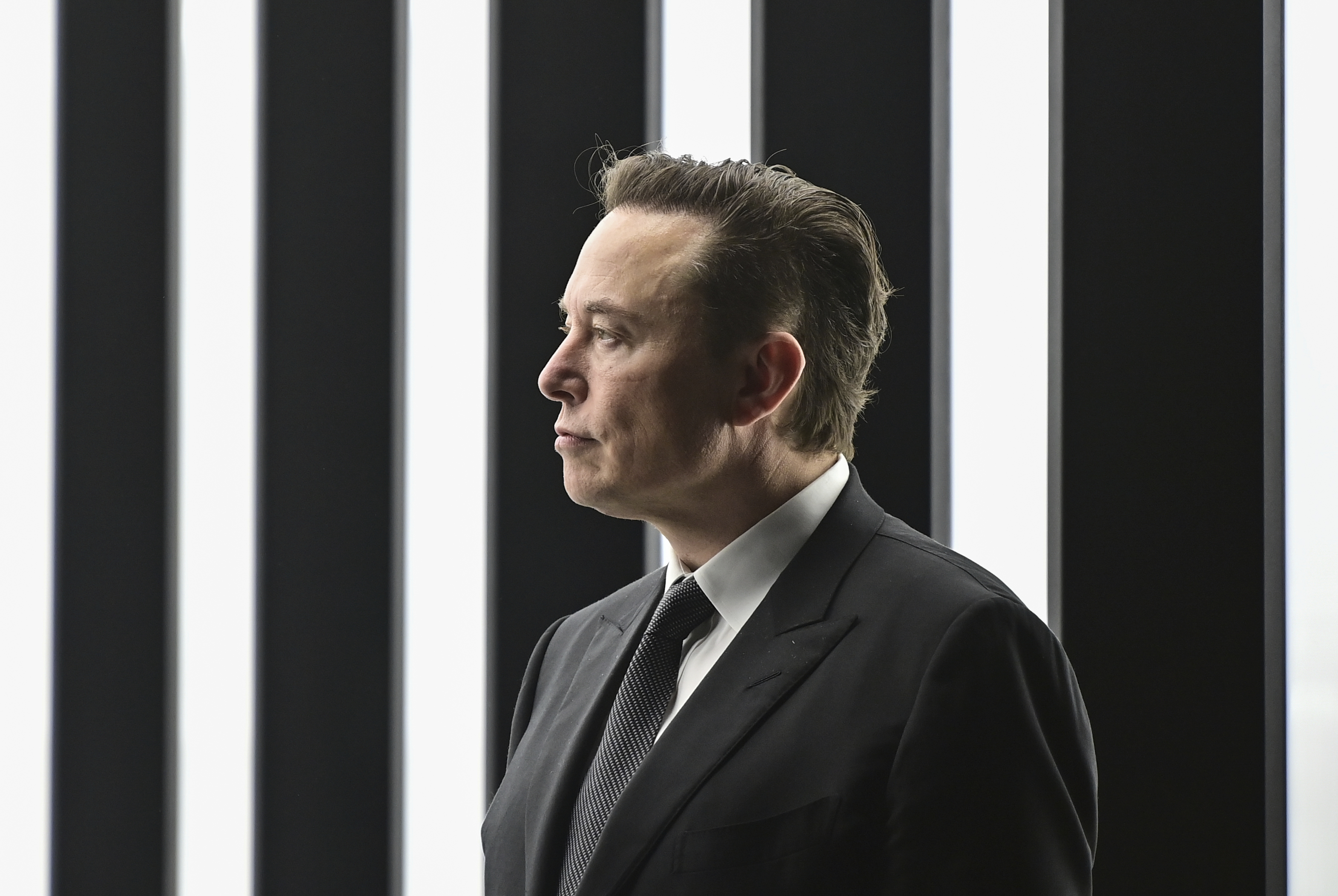 Elon Musk, Tesla CEO, attends the opening of the Tesla factory Berlin Brandenburg in Gruenheide, Germany, March 22. Trading in shares of Twitter were halted after the stock spiked on reports that Elon Musk would proceed with his $44 billion deal to buy the company after months of legal battles.