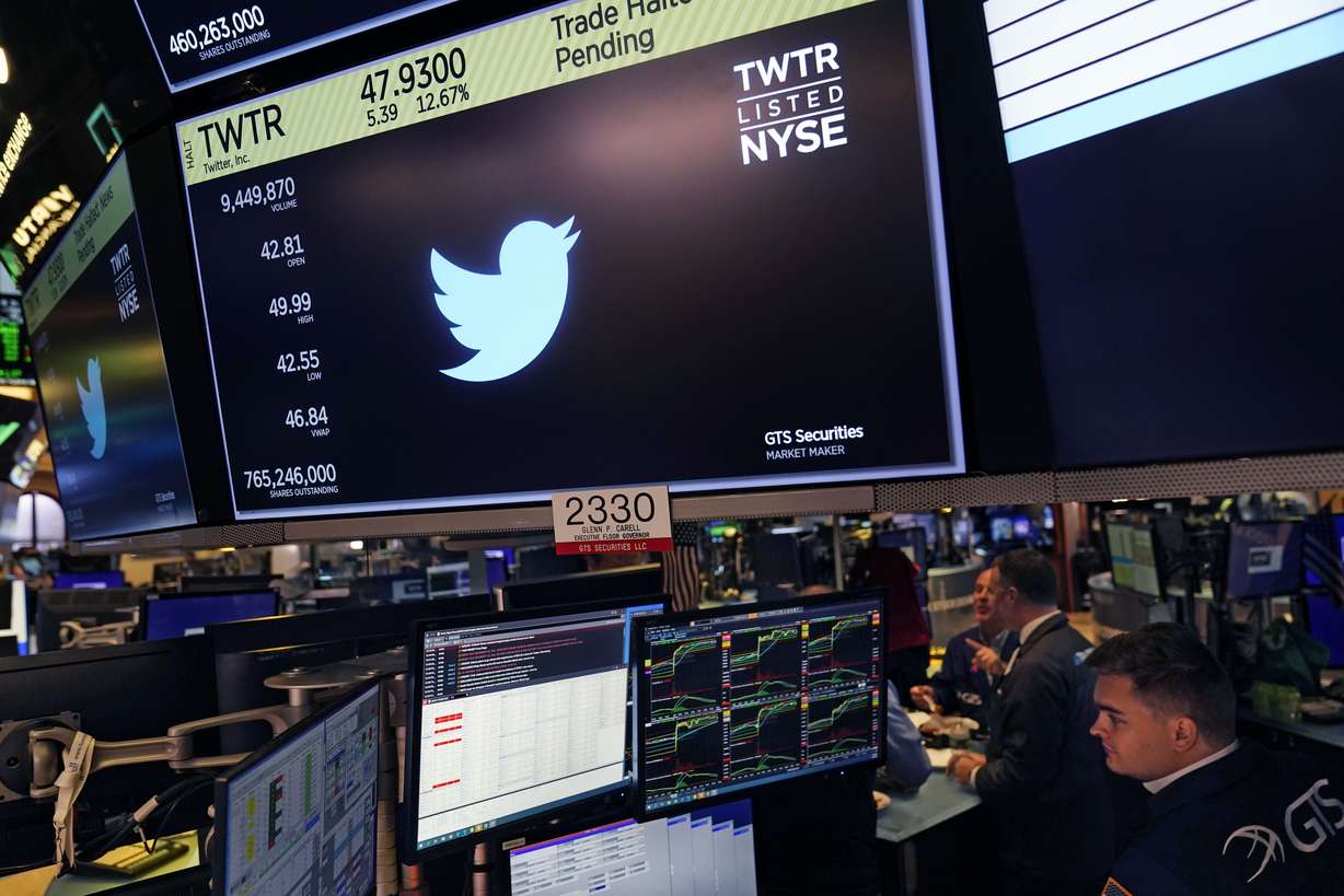 The symbol for Twitter appears above a trading post on the floor of the New York Stock Exchange, Tuesday. Trading in shares of Twitter was halted after the stock spiked on reports that Elon Musk would proceed with his $44 billion deal to buy the company after months of legal battles.