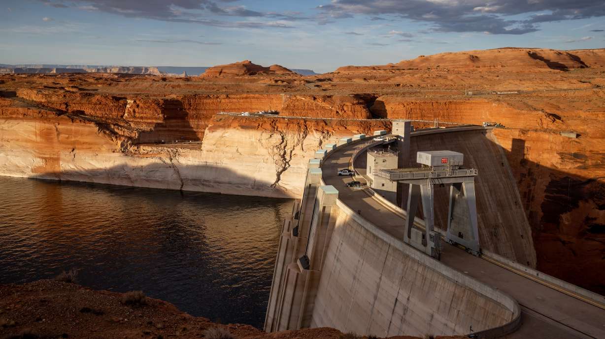 The Glen Canyon Dam holds back the waters of Lake Powell in Page, Arizona, on July 18, 2022. Federal officials believe Lake Powell will rise another 50 to 90 feet by the end of June.