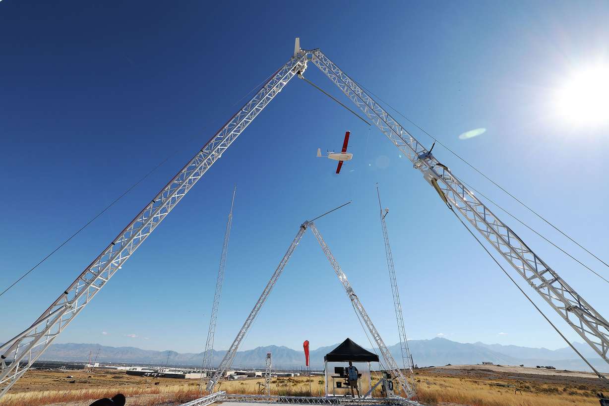 A Zipline drone lands in a hook system in South Jordan on Tuesday. Zipline and Intermountain Healthcare will begin drone deliveries for prescriptions and medical products in the Salt Lake Valley.