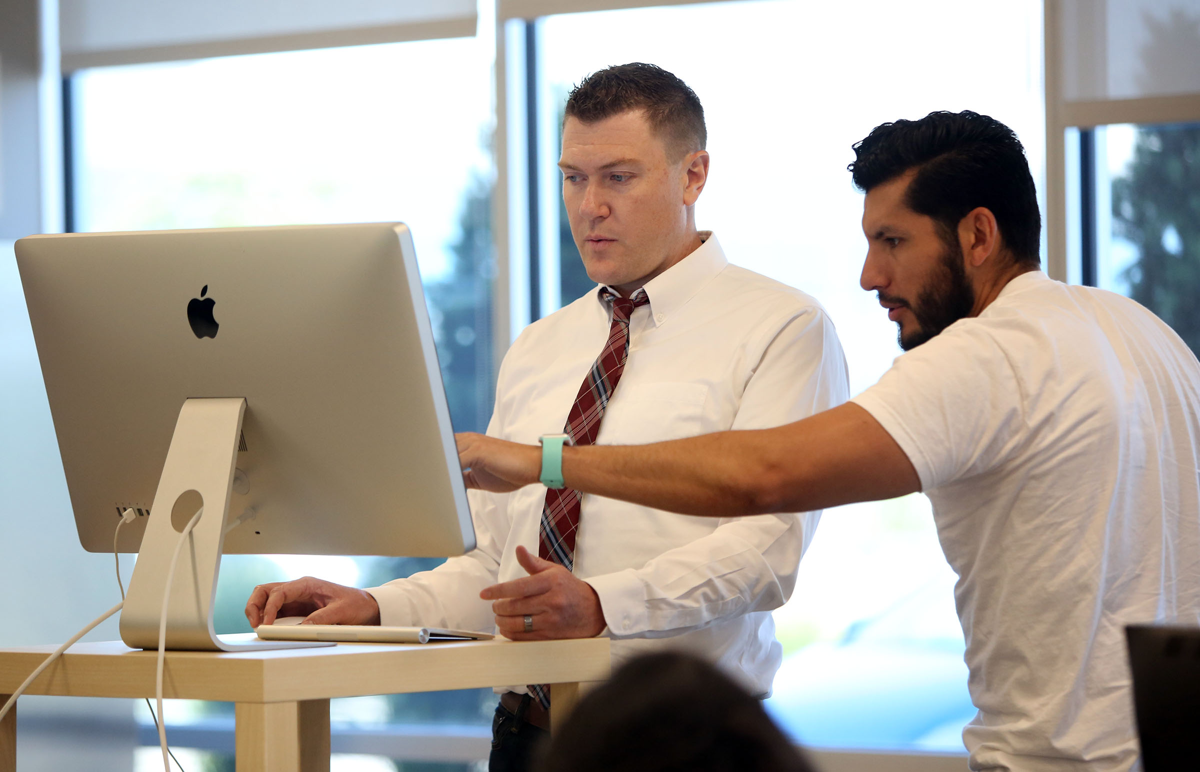 Johnny Hanna, CEO and co-founder of Homie, left, works with Mike Peregrina, chief financial officer and co-founder of Homie, at the company's headquarters in Draper on June 7, 2017. Hanna announced that he will be stepping down as CEO of the company. His announcement followed a week in which 40 employees at Homie were laid off.