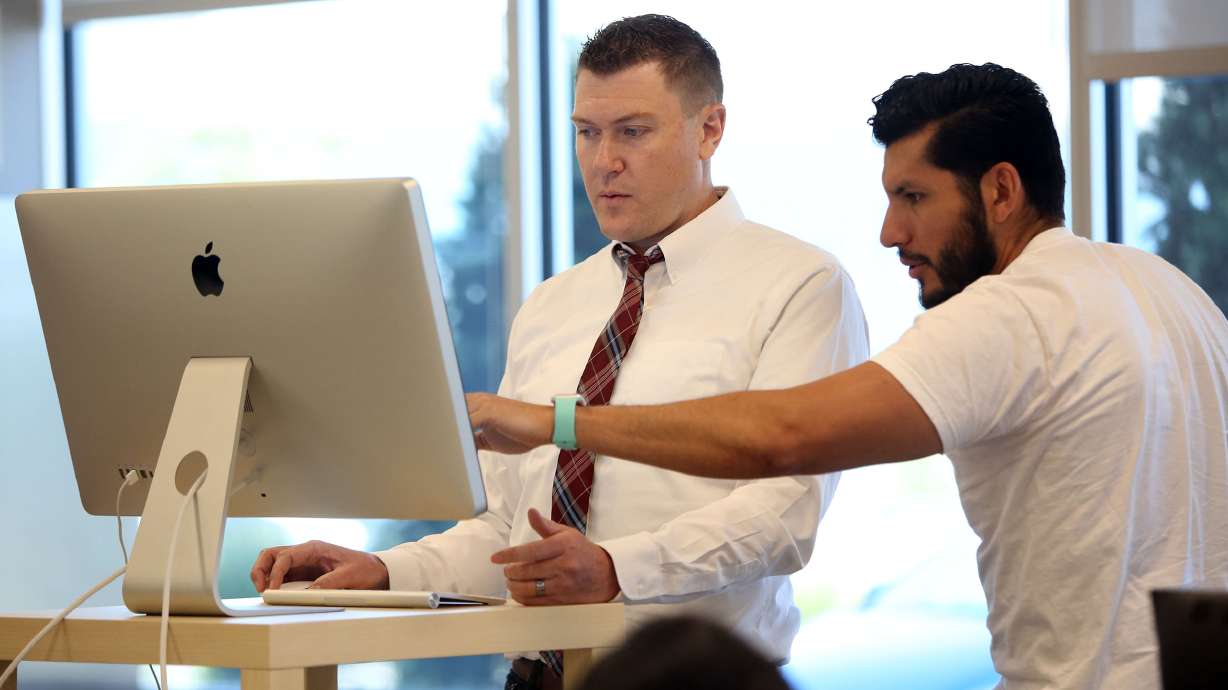 Johnny Hanna, CEO and co-founder of Homie, left, works with Mike Peregrina, chief financial officer and co-founder of Homie, at the company's headquarters in Draper on June 7, 2017. Hanna announced that he will be stepping down as CEO of the company. His announcement followed a week in which 40 employees at Homie were laid off.