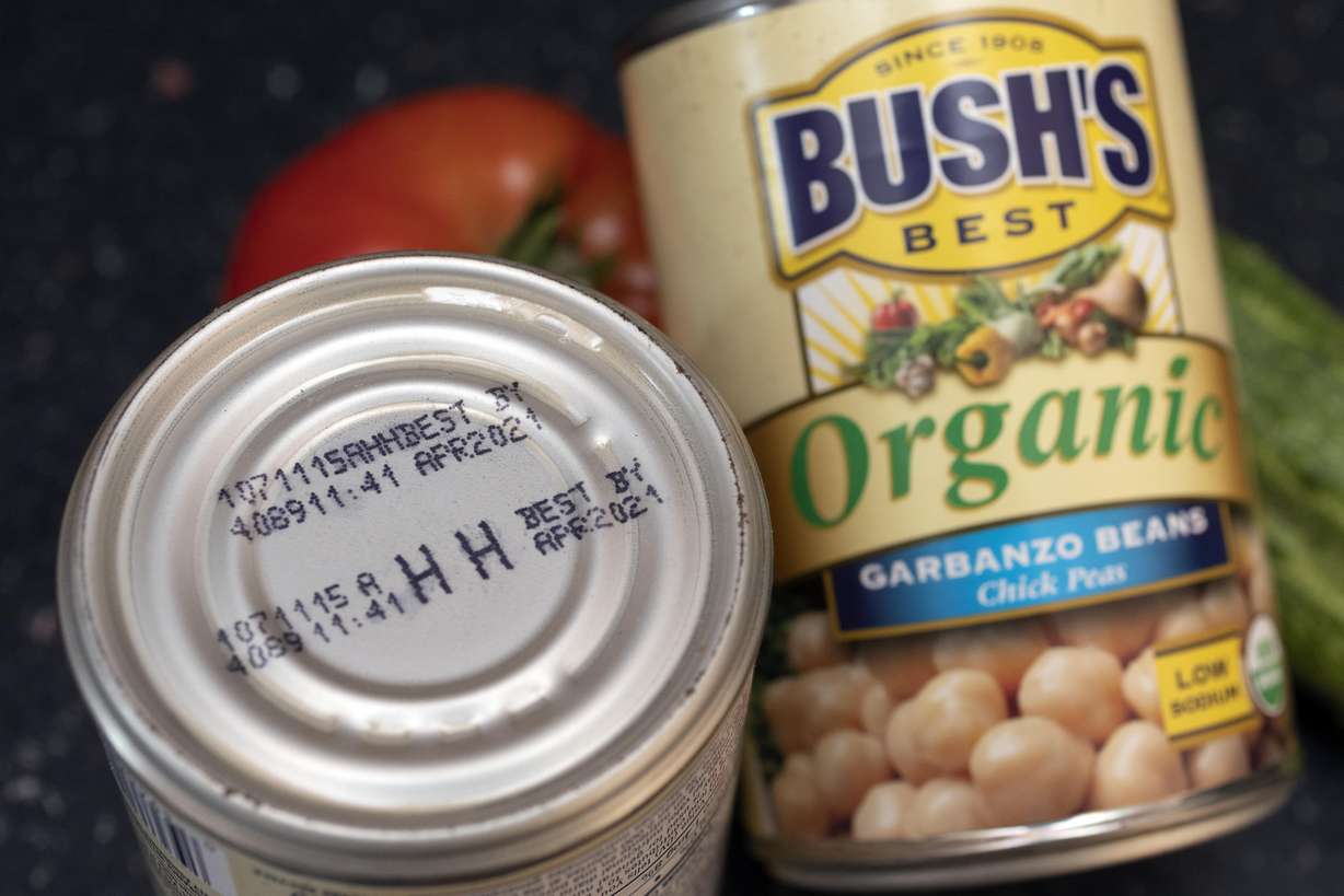 An expired "best by" date is seen on a can of garbanzo beans, Aug. 20, in Boston.
