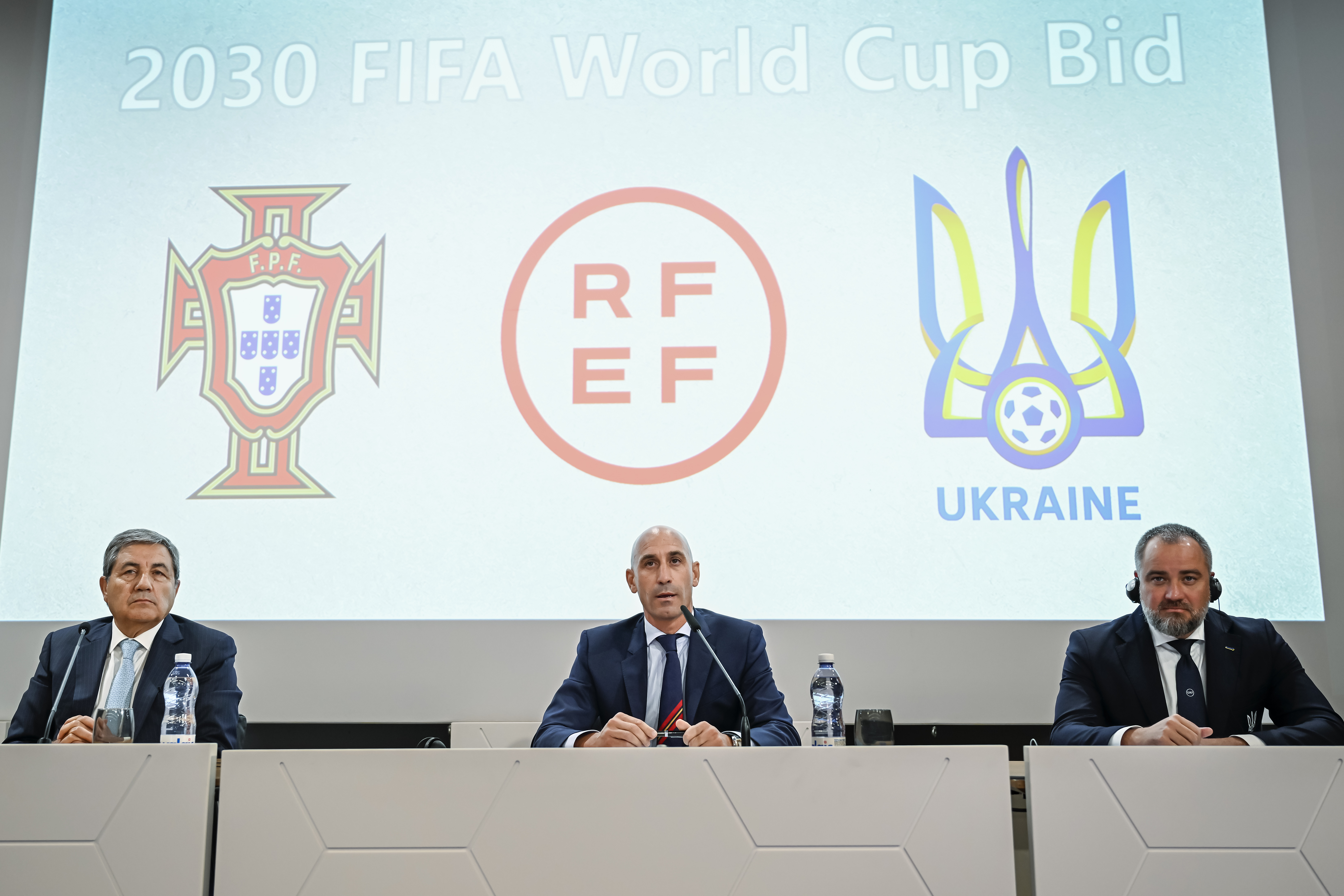 Portuguese Soccer Federation President Fernando Gomes, left, President of the Spanish Royal Federation of Soccer (RFEF), Luis Rubiales, center, Ukrainian Football Federation President Andriy Pavelko, right, speak during a press conference about the announcing that Ukraine is joining Spain and Portugal in their joint bid to host the World Cup in 2030, at the UEFA Headquarters, in Nyon, Switzerland, Wednesday, October 5, 2022. The proposal harnesses the idea that football can restore hope and peace, while Ukraine has been at war with Russia for months.