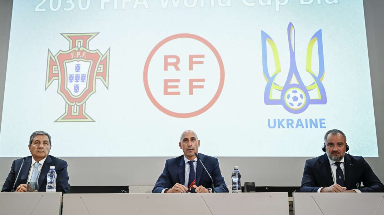 Portuguese Soccer Federation President Fernando Gomes, left, President of the Spanish Royal Federation of Soccer (RFEF), Luis Rubiales, center, Ukrainian Football Federation President Andriy Pavelko, right, speak during a press conference about the announcing that Ukraine is joining Spain and Portugal in their joint bid to host the World Cup in 2030, at the UEFA Headquarters, in Nyon, Switzerland, Wednesday, October 5, 2022. The proposal harnesses the idea that football can restore hope and peace, while Ukraine has been at war with Russia for months.