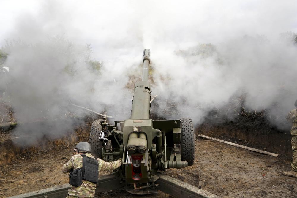 Ukrainian soldiers fire, on the front line in the Kharkiv region, Ukraine, Wednesday.