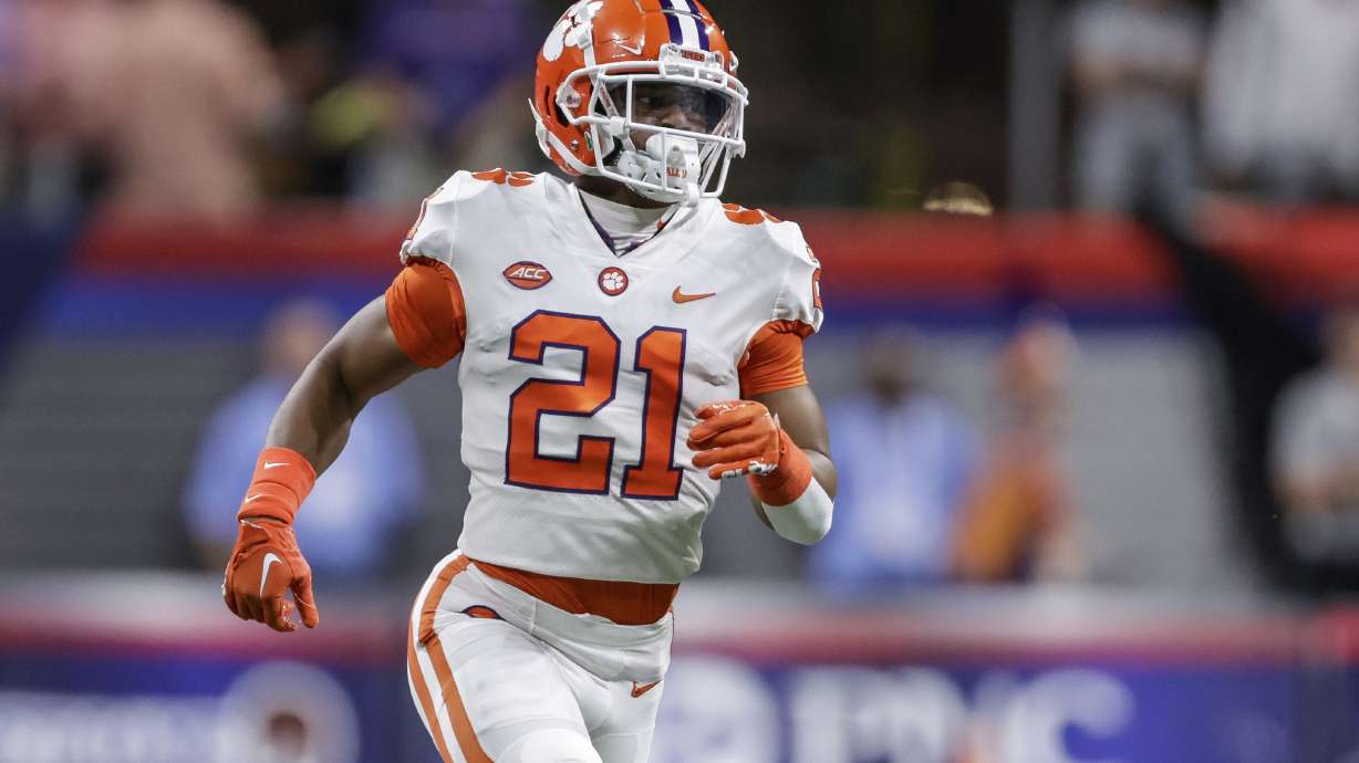 FILE - Clemson's Malcolm Greene runs on the field during the first half of the team's NCAA football game against Georgia Tech on Sept. 5, 2022, in Atlanta. Clemson defensive backs Greene and Fred Davis II are being sued by a U.S. postal worker whose car Davis collided with last year. The suit was filed Wednesday, Oct. 5, in Pickens County Common Pleas Court in South Carolina, a form of civil court.