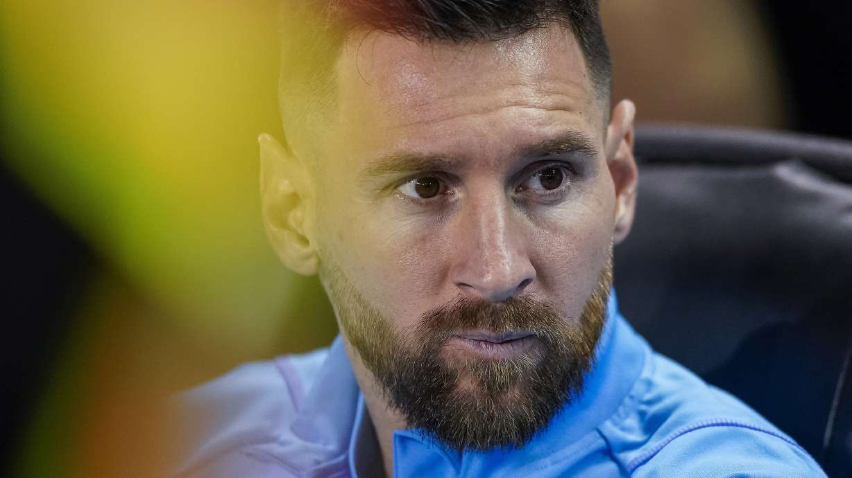 Argentina forward Lionel Messi sits before the team's international friendly soccer match against Jamaica on Tuesday, Sept. 27, 2022, in Harrison, N.J.