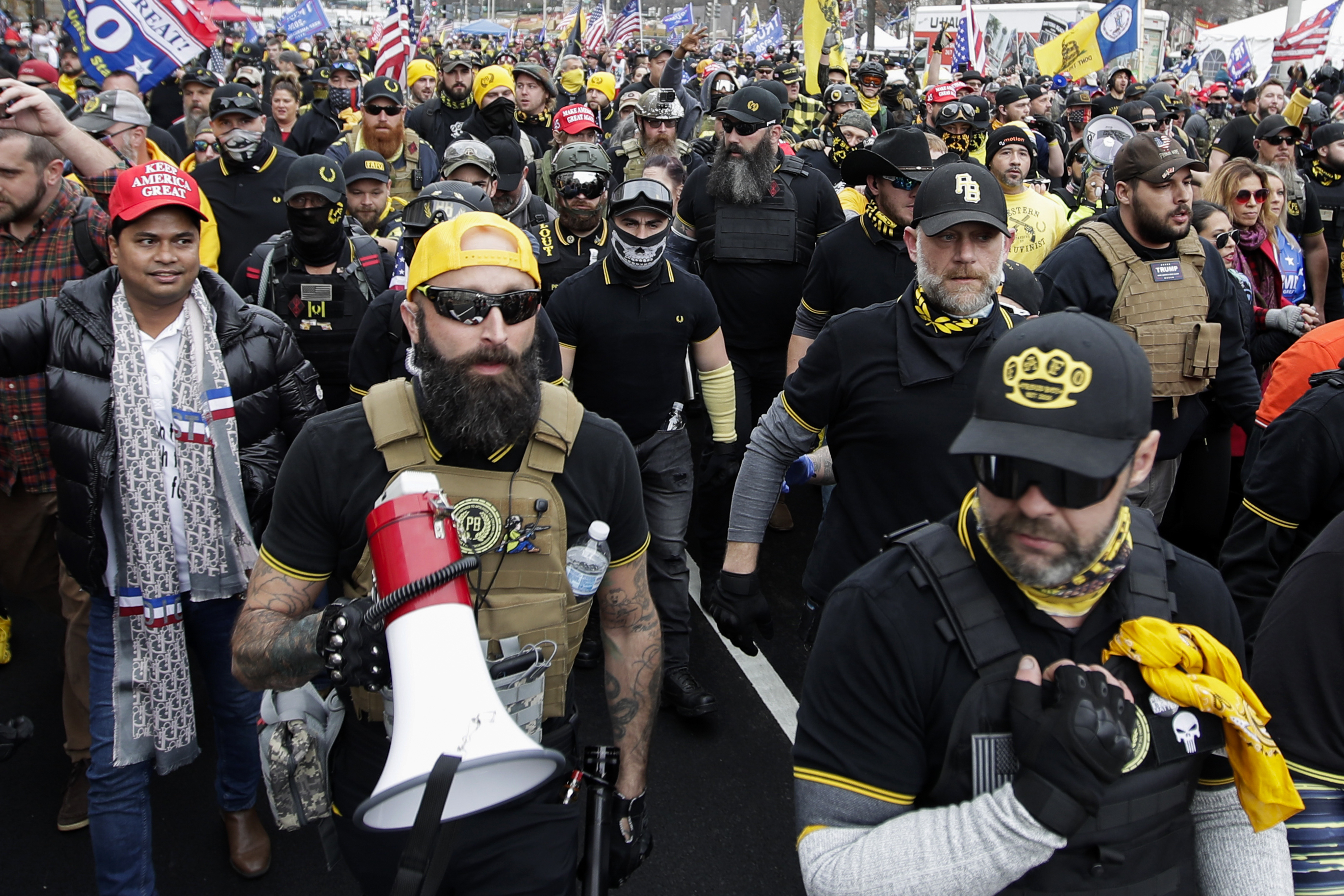 Far-right Proud Boys member Jeremy Joseph Bertino, second from left, joins other supporters of President Donald Trump who are wearing attire associated with the Proud Boys as they attend a rally at Freedom Plaza, Dec. 12, 2020, in Washington. Bertino pleaded guilty on Thursday to plotting with other members of the Proud Boys to violently stop the transfer of presidential power after the 2020 election, making him the first member of the extremist group to plead guilty to a seditious conspiracy charge.  - Luis M. Alvarez, Associated Press
