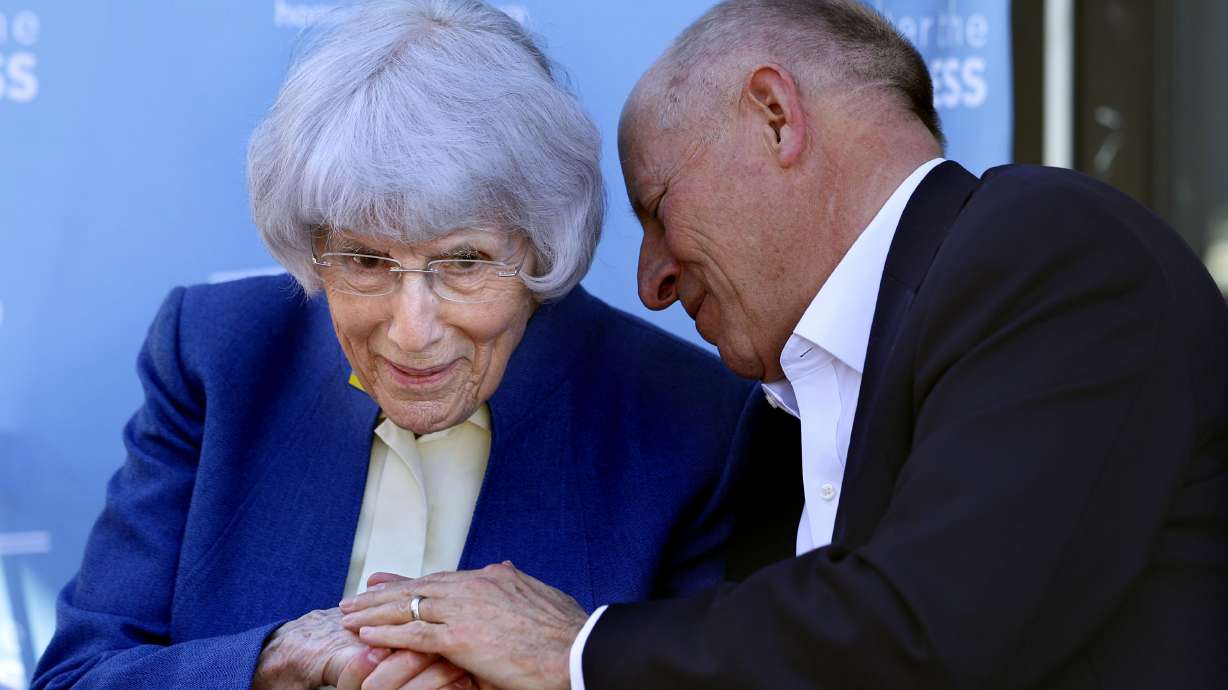 Pamela Atkinson listens to Harris H. Simmons, president of the board of trustees for Shelter the Homeless, at a ceremony naming the Men’s Resource Center as the Pamela Atkinson Resource Center in South Salt Lake on Thursday.