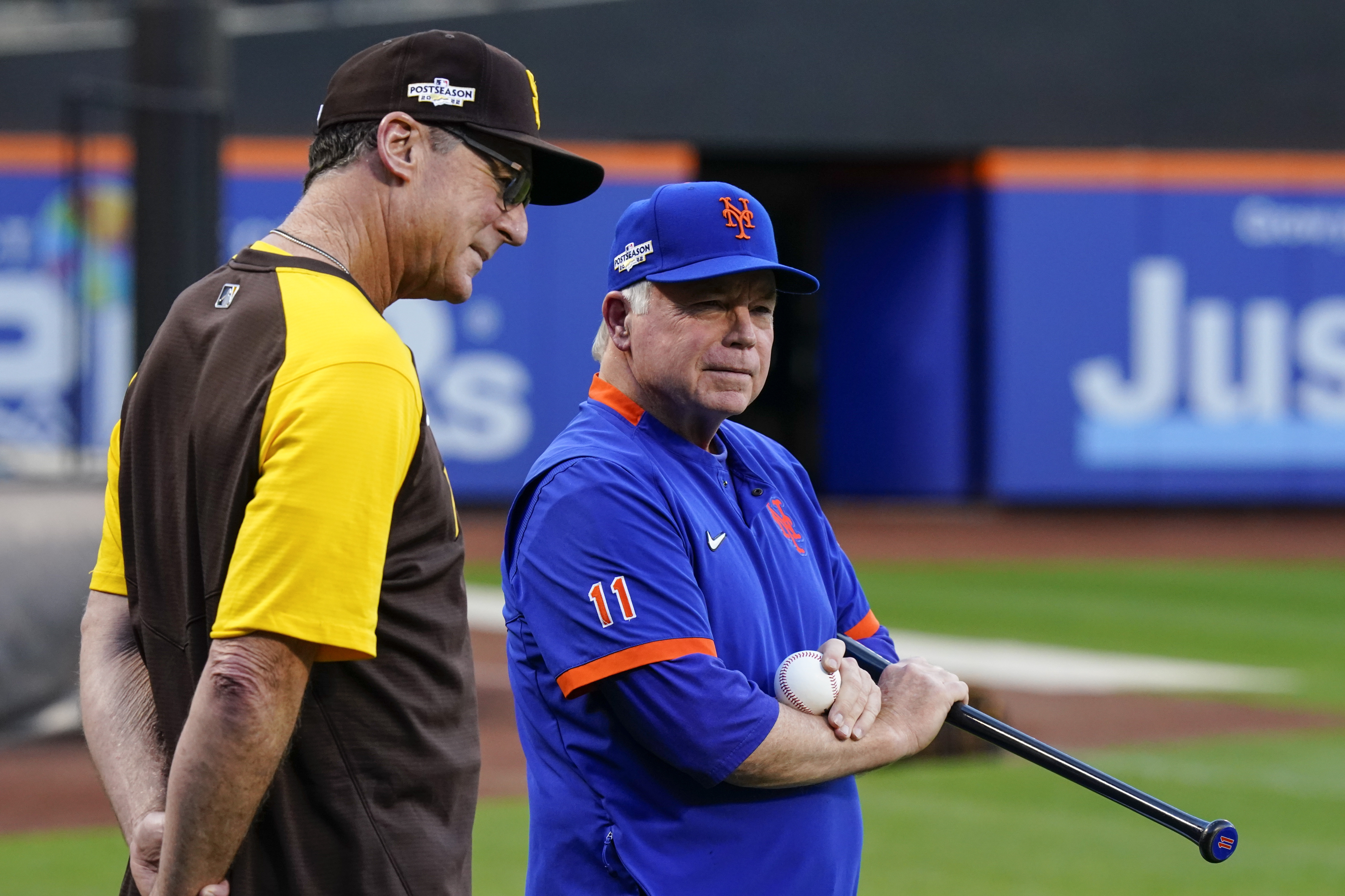New York Mets manager Buck Showalter, right, talks to San Diego Padres manager Bob Melvin during batting practice the day before their wild-card baseball playoff game, Thursday, Oct. 6, 2022, in New York.