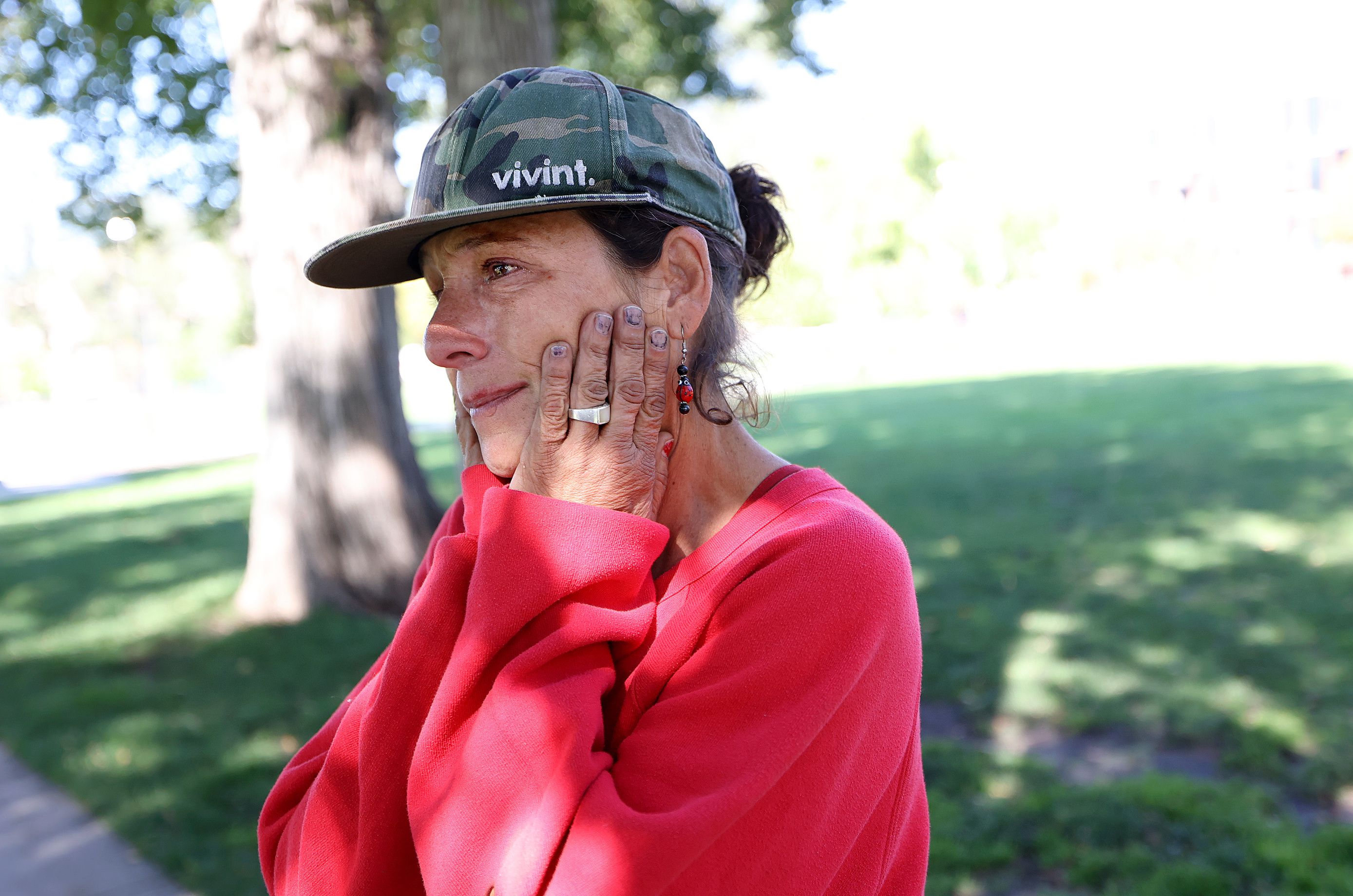 Jeralyn Delamare, 53, gets emotional while talking about being homeless in Pioneer Park in Salt Lake City on Thursday.