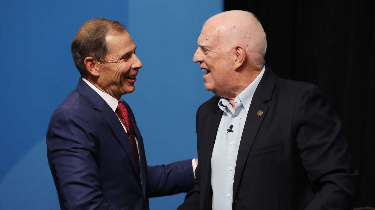 Rep. John Curtis, R-Utah, and Glenn Wright shake hands after debating in the 3rd Congressional District debate at the KBYU Broadcasting building in Provo on Thursday.