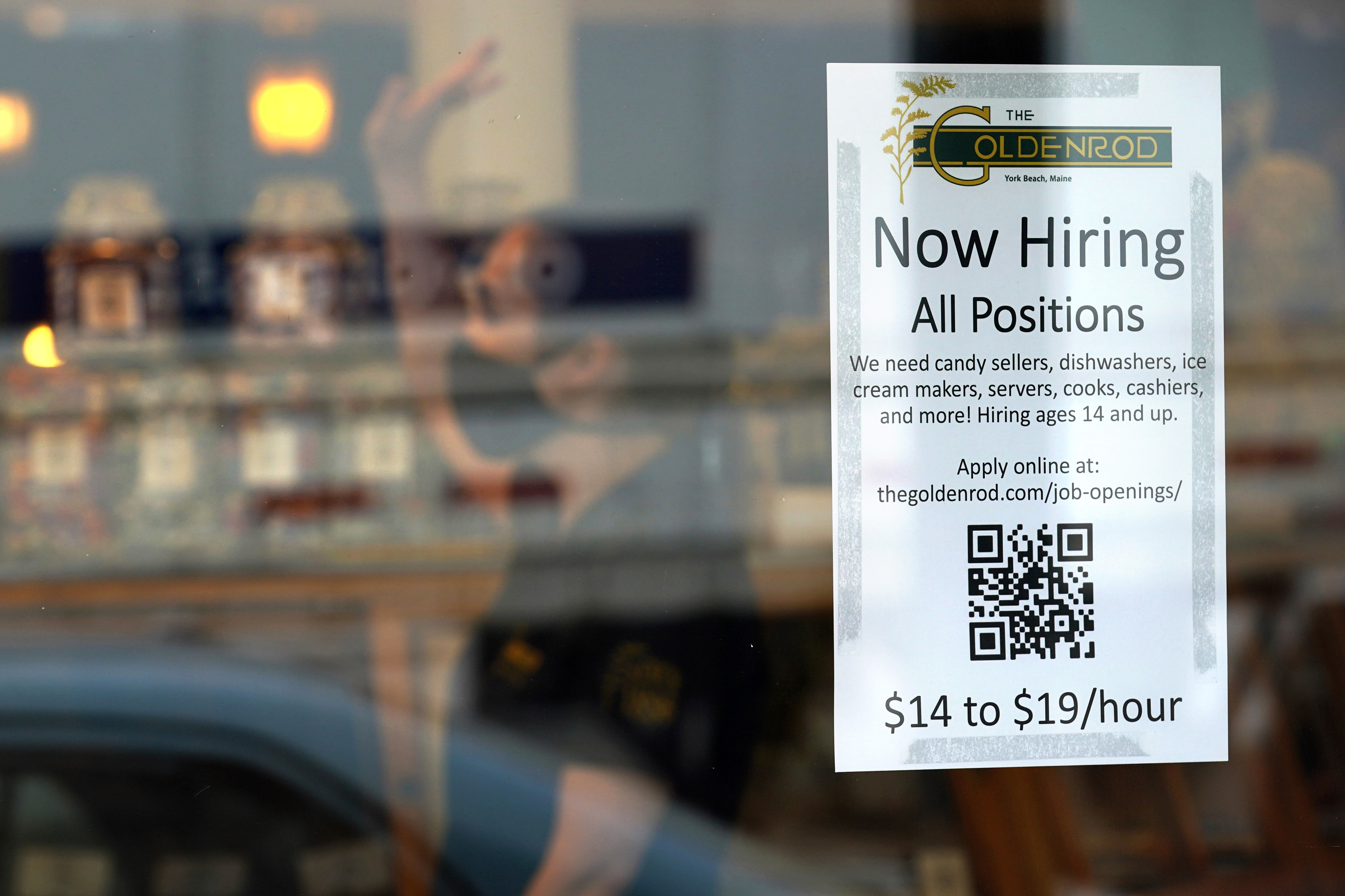 A sign advertises for help The Goldenrod, a popular restaurant and candy shop, June 1 in York Beach, Maine. America's employers slowed their hiring in September but still added a solid 263,000 jobs, the Labor Department announced Friday.