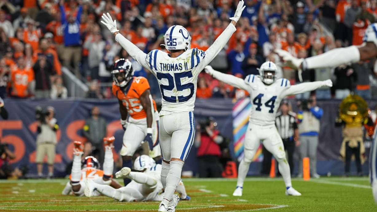 Indianapolis Colts safety Rodney Thomas II (25) and linebacker Zaire Franklin (44) celebrate after an NFL football game against the Denver Broncos, Thursday, Oct. 6, 2022, in Denver. The Colts defeated the Broncos 12-9 in overtime.