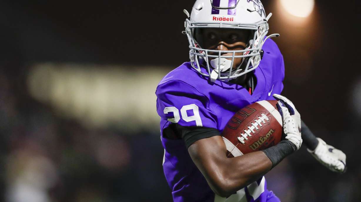Devaughn Eka of the Lehi Pioneers kick runs the ball while playing the Timpview Thunderbirds in Lehi on Thursday, Oct. 6, 2022.