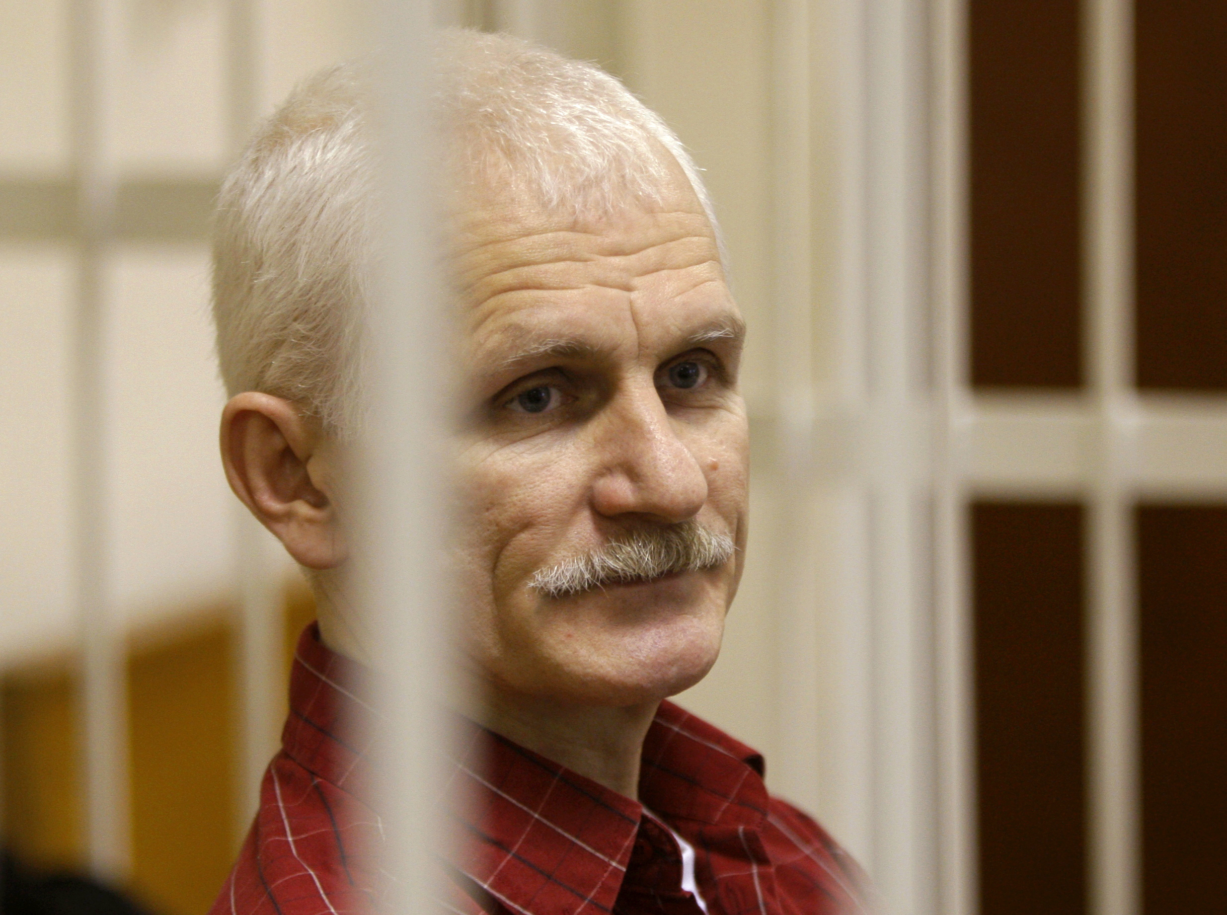 Ales Bialiatski, the head of Belarusian Vyasna rights group, stands in a defendants' cage during a court session in Minsk, Belarus, on Nov. 2, 2011. On Friday the Nobel Peace Prize was awarded to Bialiatski, the Russian group Memorial and the Ukrainian organization Center for Civil Liberties.
