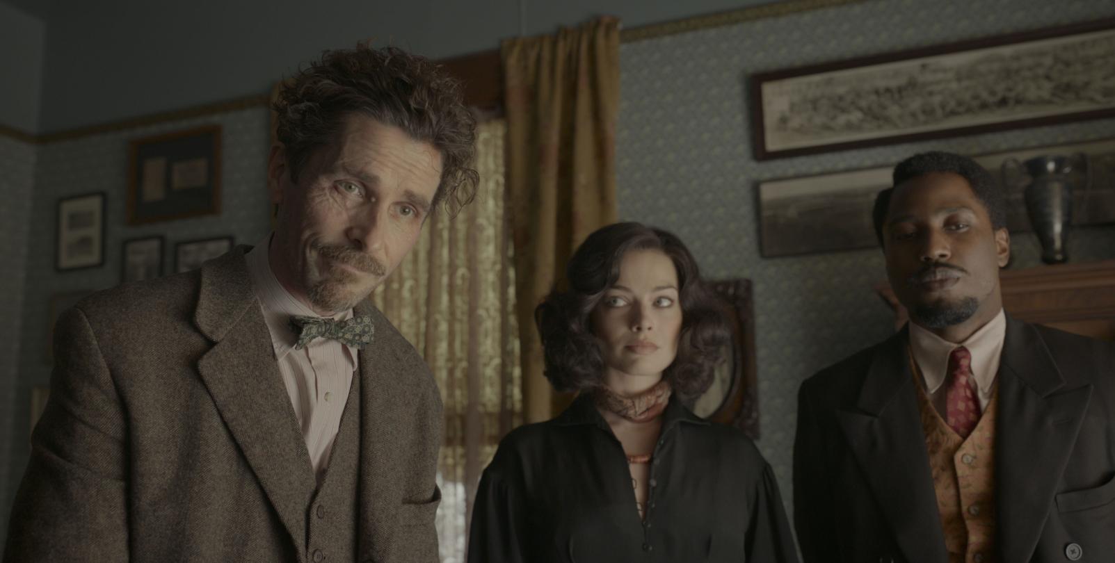 Christian Bale, John David Washington and Margot Robbie in "Amsterdam," which opened in theaters Thursday.