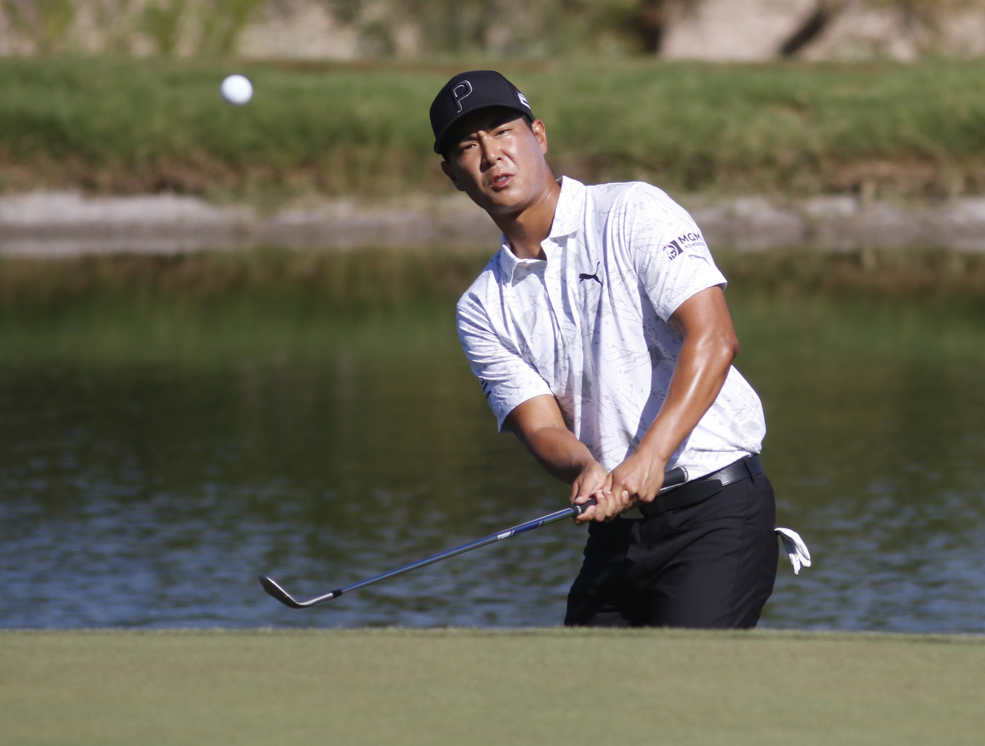 Justin Suh hits to the 17th green during the second round of the Shriners Children's Open golf tournament at TPC Summerlin, Friday, Oct. 7, 2022, in Las Vegas. 