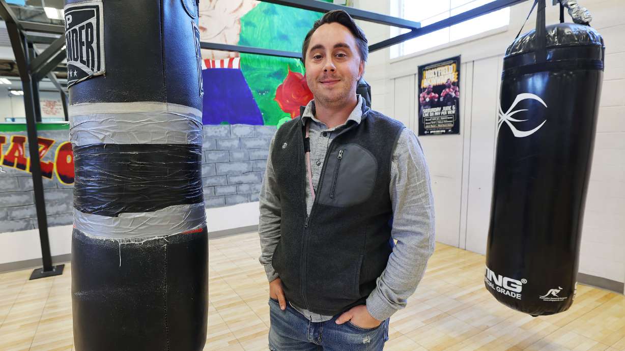 Patrick Holman, South Salt Lake City's Central Park Community Center/PAL Boxing coordinator, stands in the boxing gym in South Salt Lake on Friday. A new Dan Jones & Associates poll asked Utahns whether they approve of the Biden administration's student loan forgiveness initiative. Holman is a University of Phoenix student who benefited.